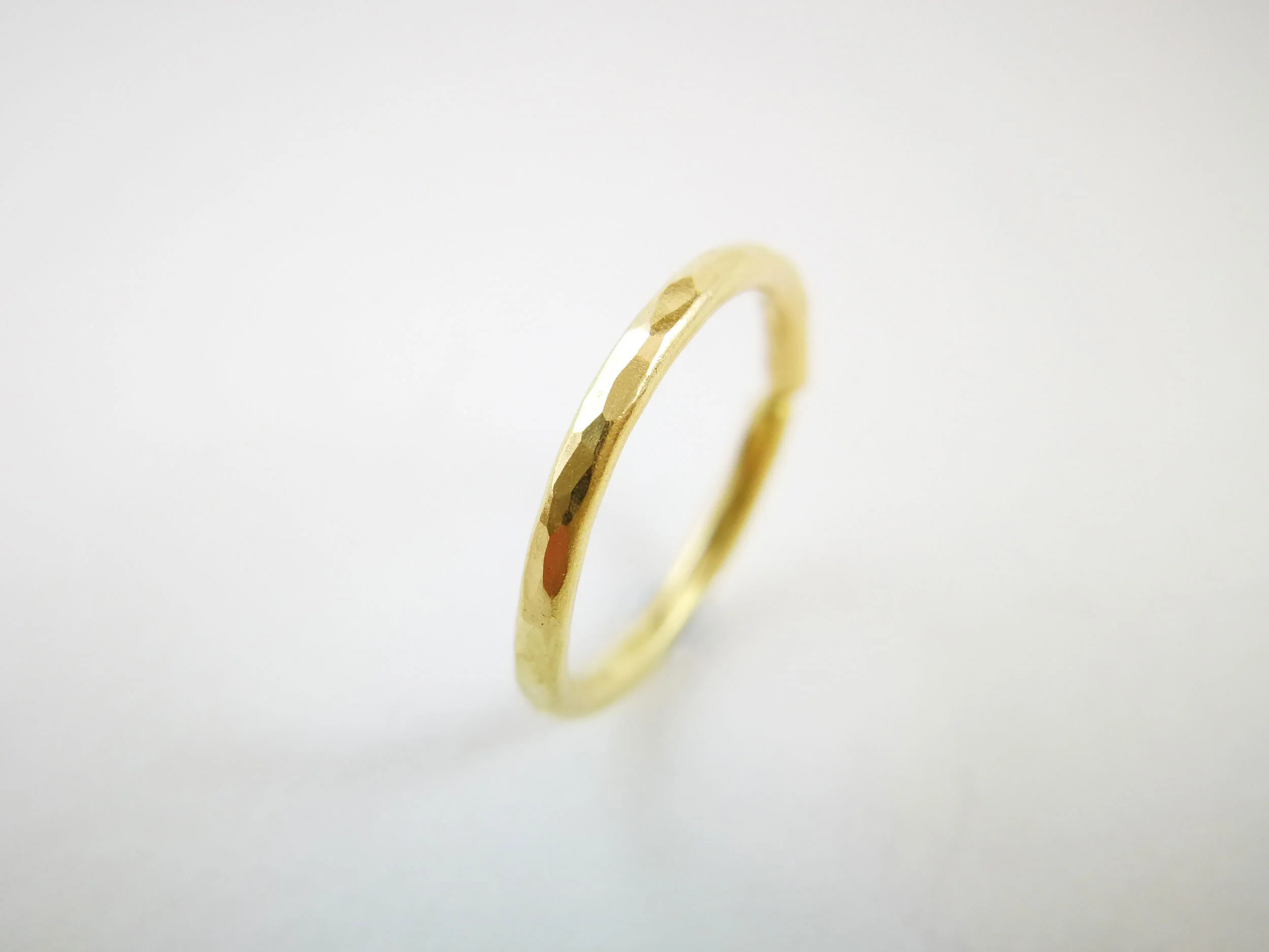 Solid 18carart gold conch hoop on white background