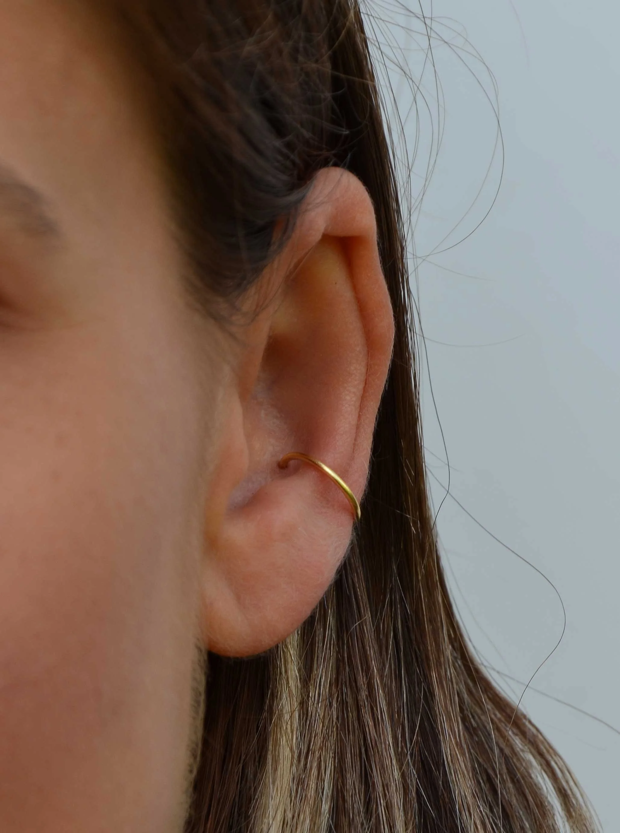18ct gold conch hoop on model victoria grace silversmith