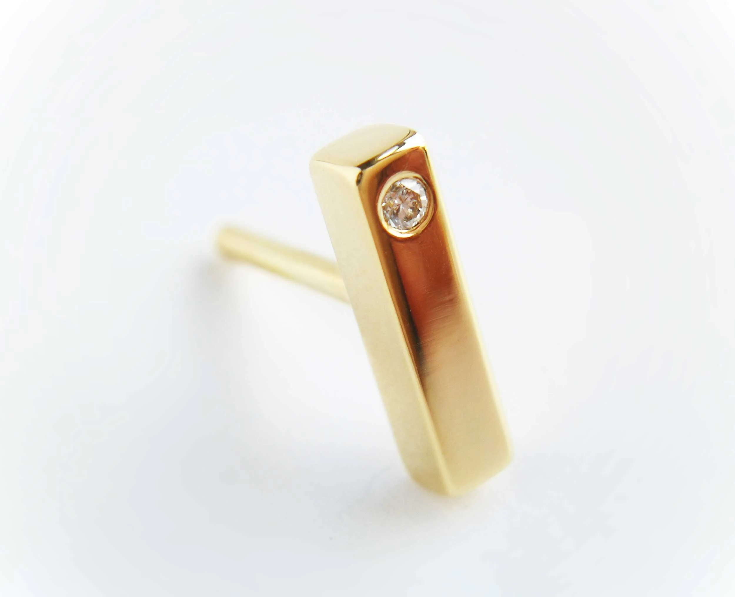 fine piercing jewellery 18ct gold and diamond earring white background