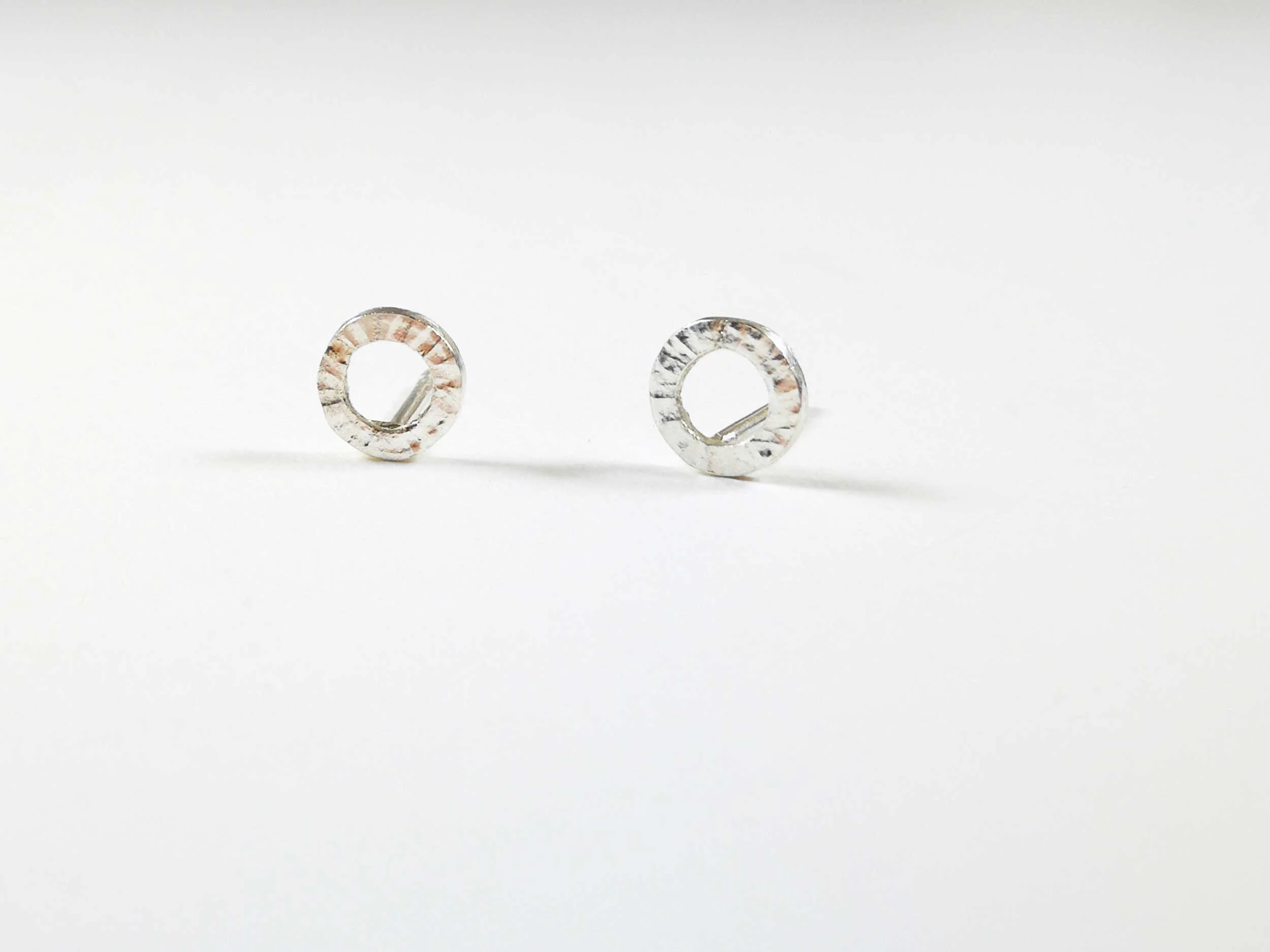 hammered-circle-silver-stud-earrings-on-white-background.jpg