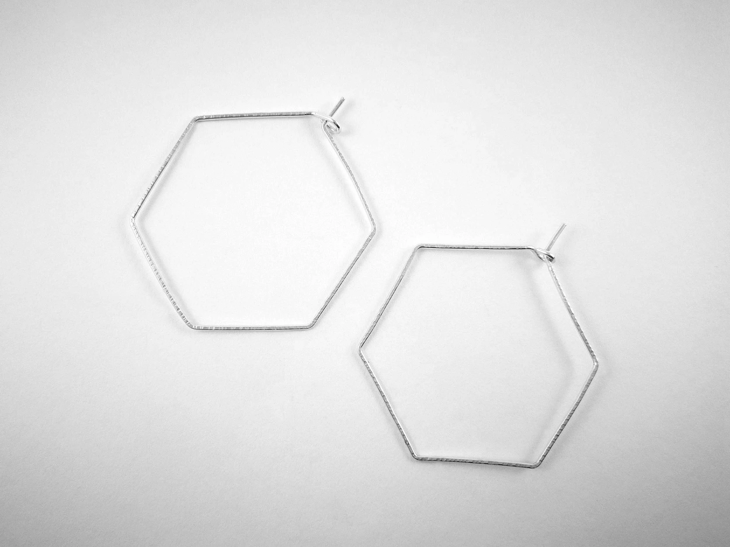 handmade hexagon earrings on white background by victoria grace silvermsith