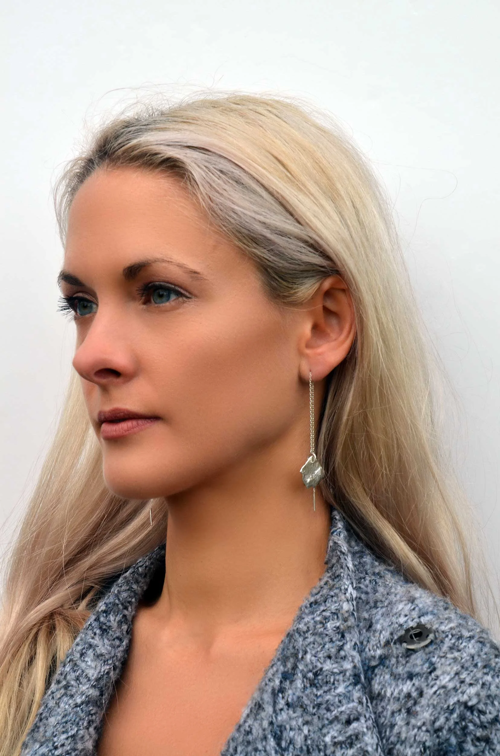 statement earrings by victoria grace silversmith on model