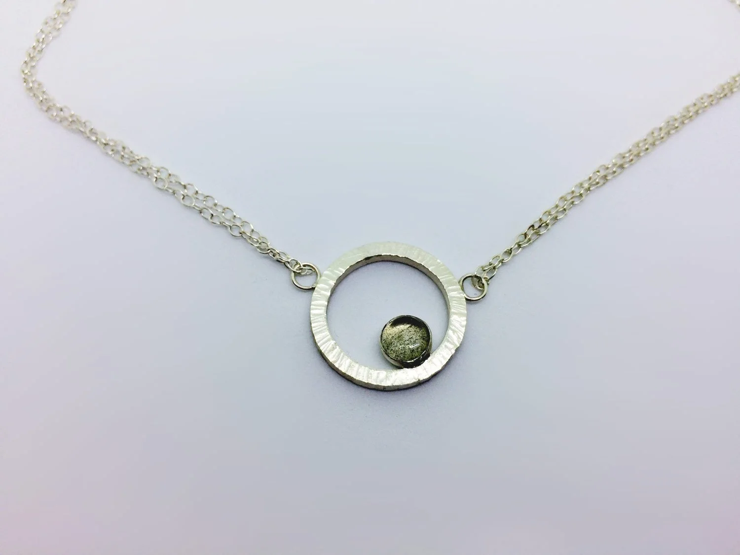 artisan silver circular pendant with labradorite on a chain