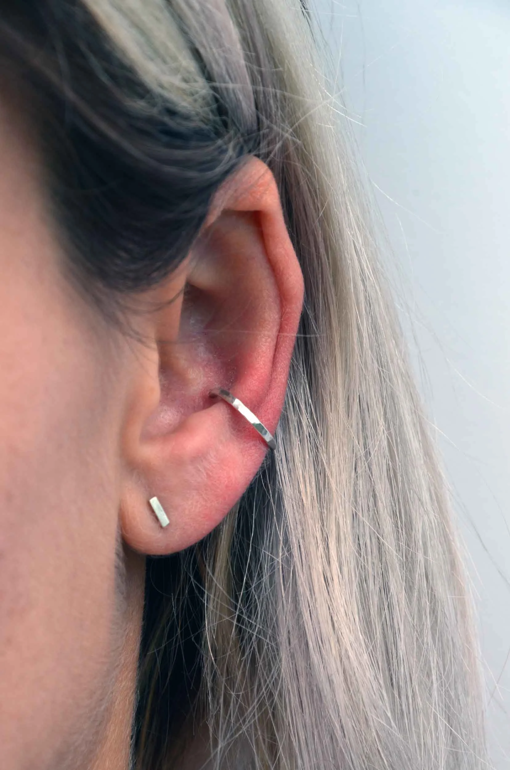 Silver conch hoop on model