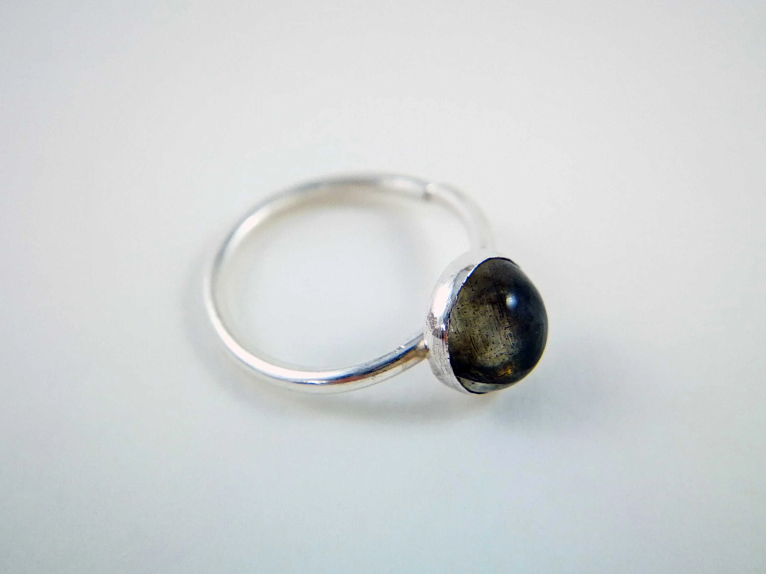labradorite conch ring on white background