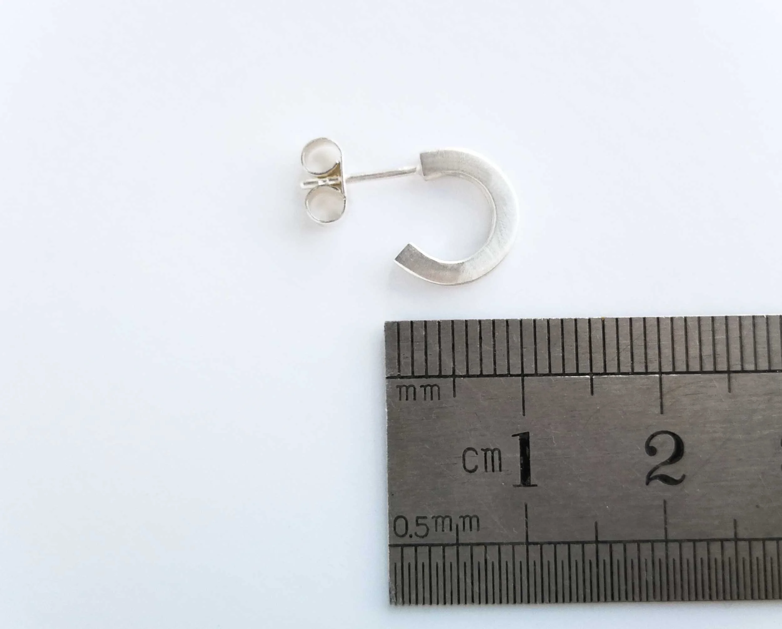 small chunky sterling silver hoop earrings white background victoria grace