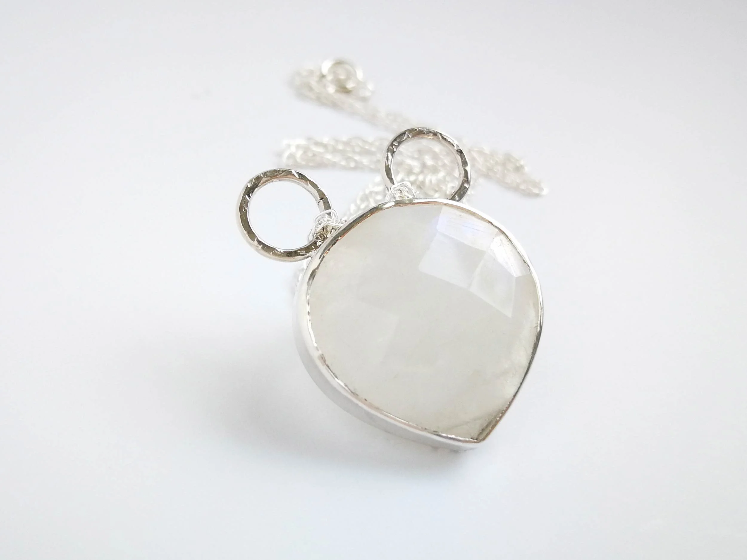 Bespoke moonstone pendant on white background handmade