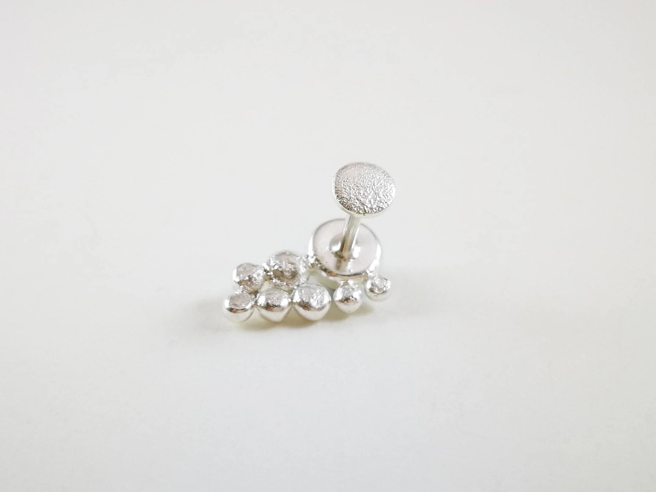 handmade-silver-conch-stud-with-reticulation.jpg