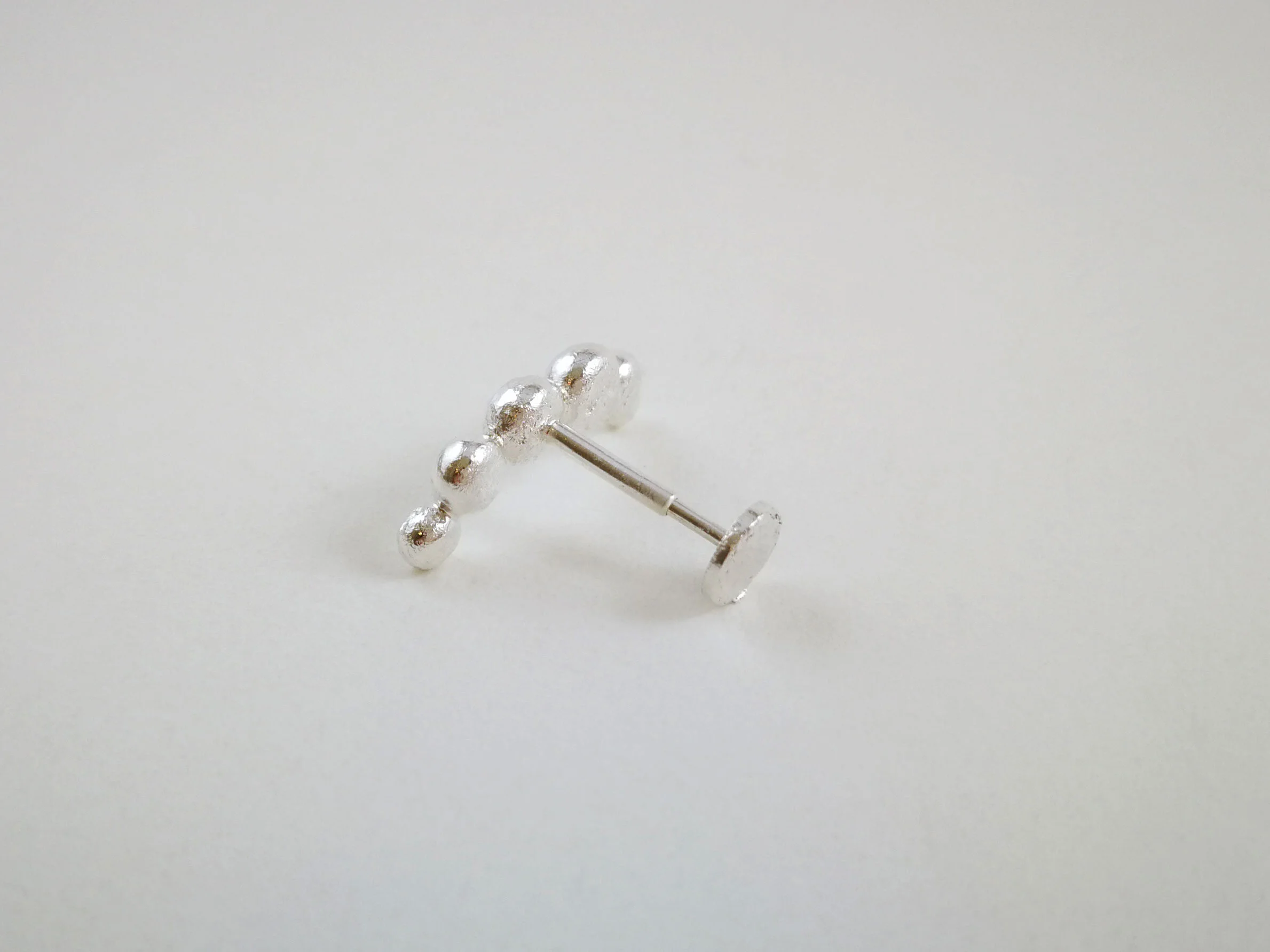 silver-conch-earring-artisan-jewellery-product-photo.jpg