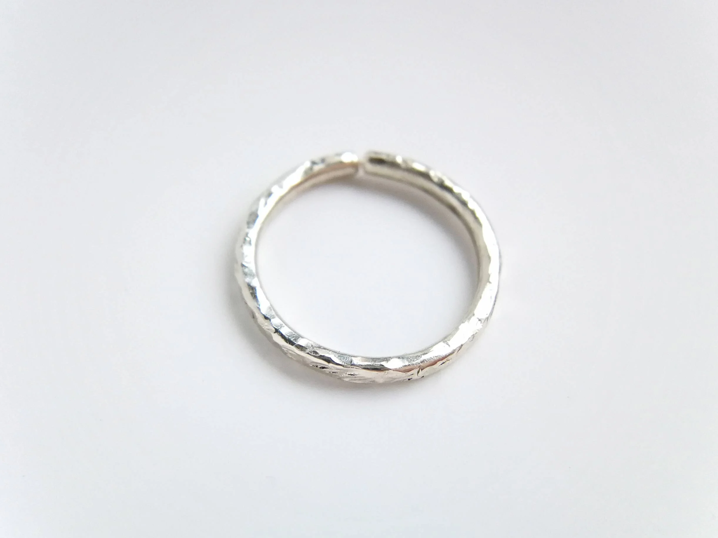 Shiny textured conch hoop on white background