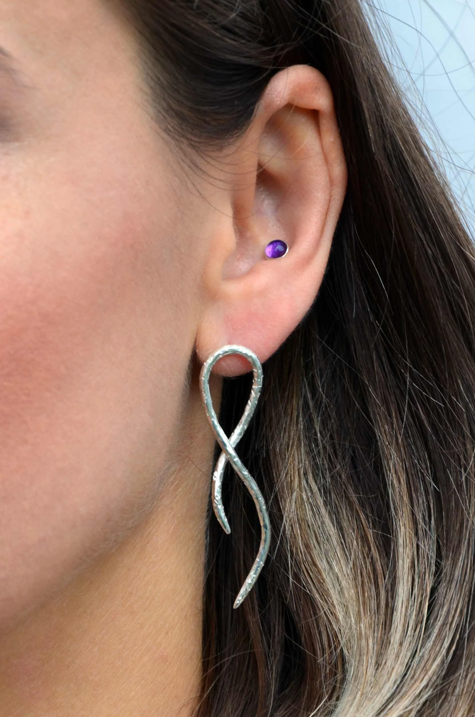 Handmade recycled silver icicle earring on model