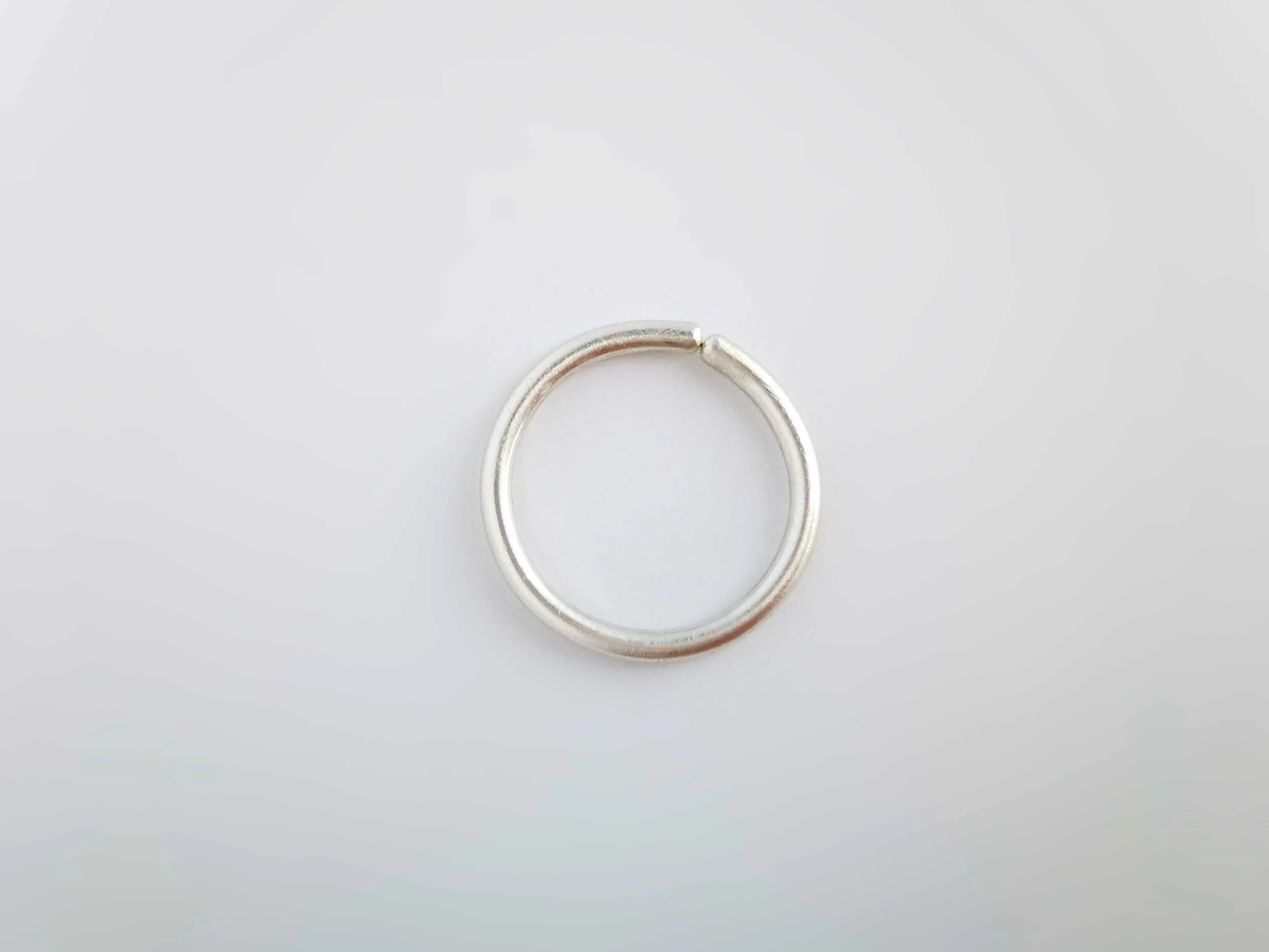 brushed satin recycled silver conch ring on white background victoria grace silversmith