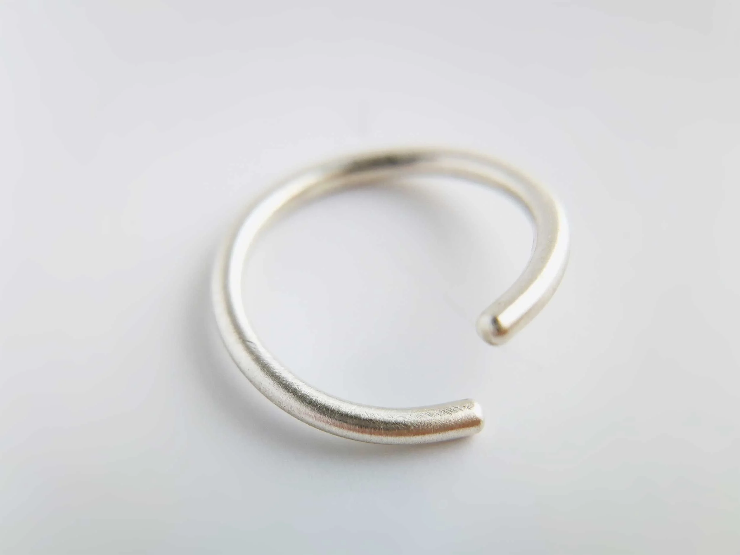 brushed satin sterling silver cartilage hoop white background