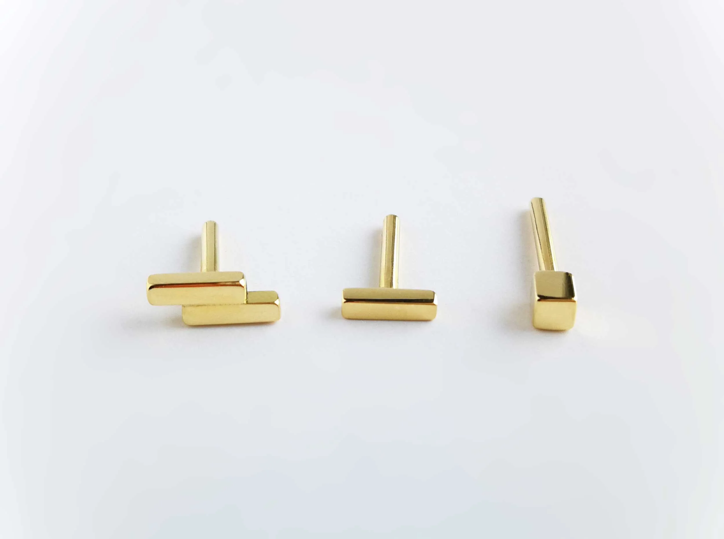solid yellow gold mismatched earring set the aurum collection white background