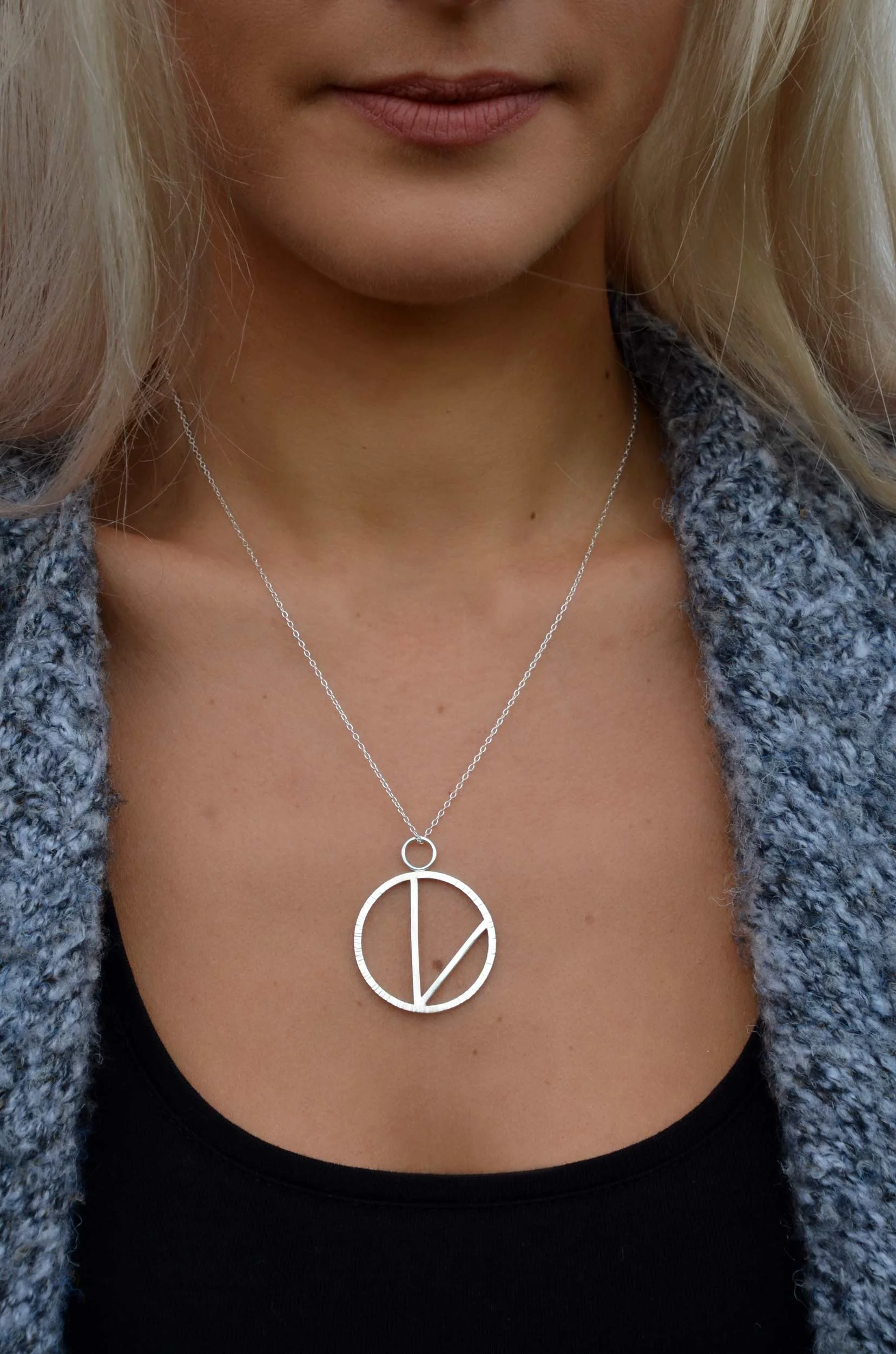 Vegan V necklace handmade by victoria grace silversmith on model