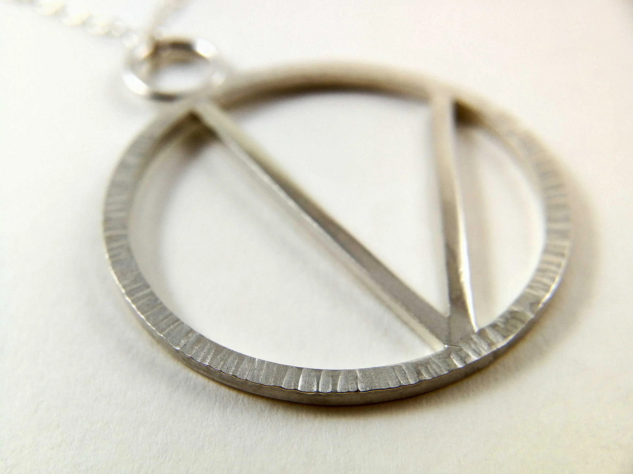 close up of silver Vegan pendant victoria grace silversmith