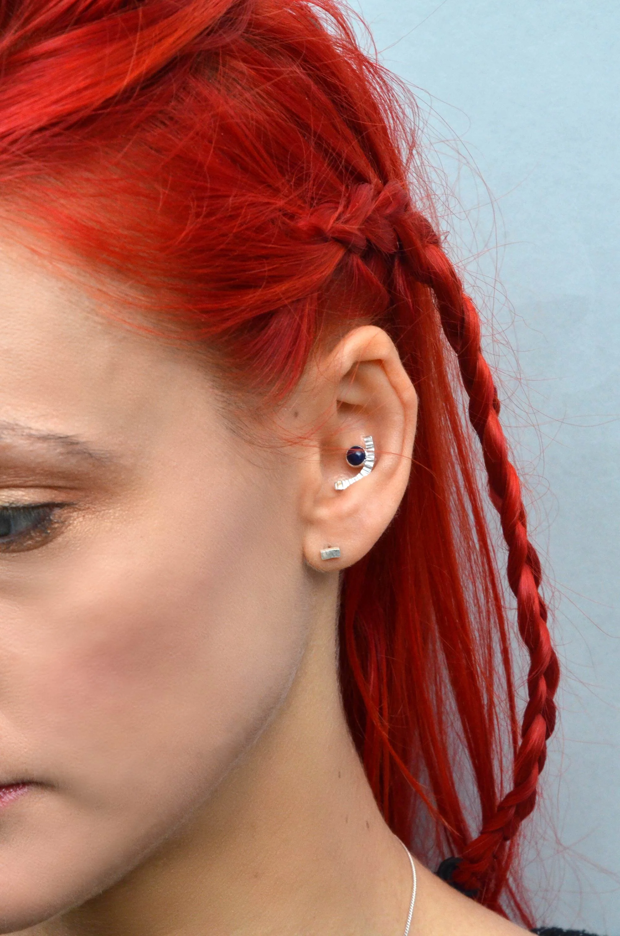 handmade sterling silver conch earring on model