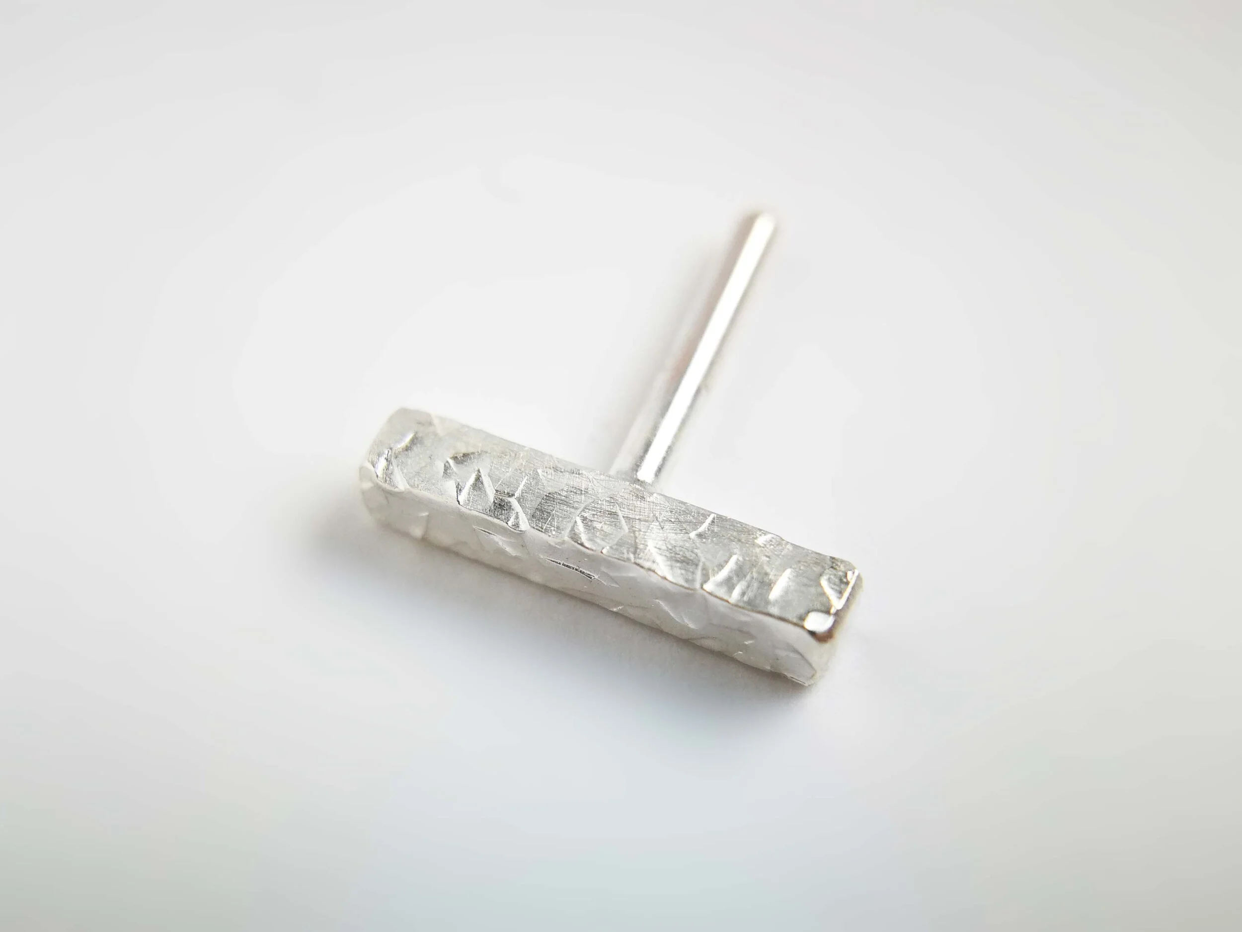 Copy of Shiny textured silver conch earring white background handmade jewellery