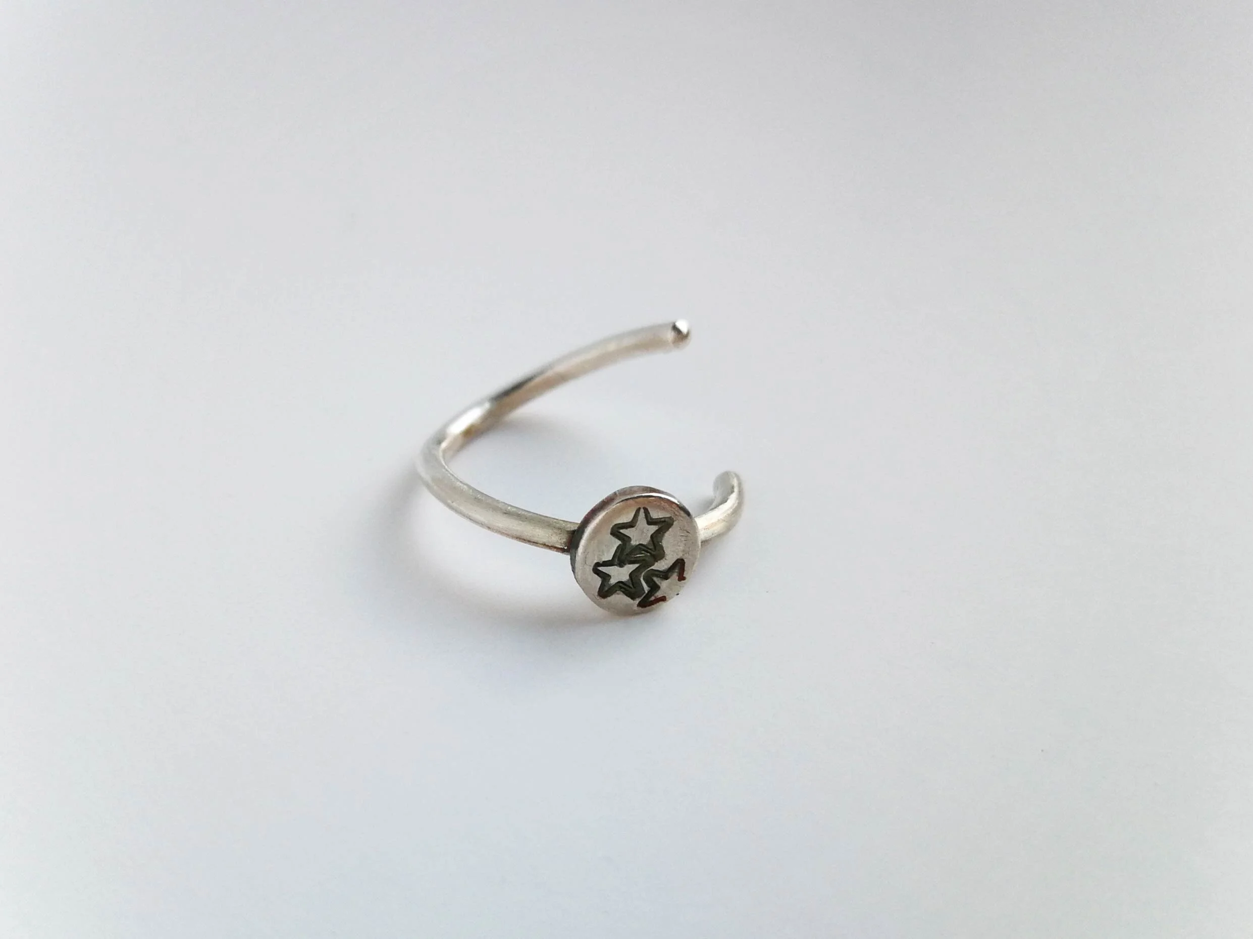 Stars helix ring on white background seamless ring