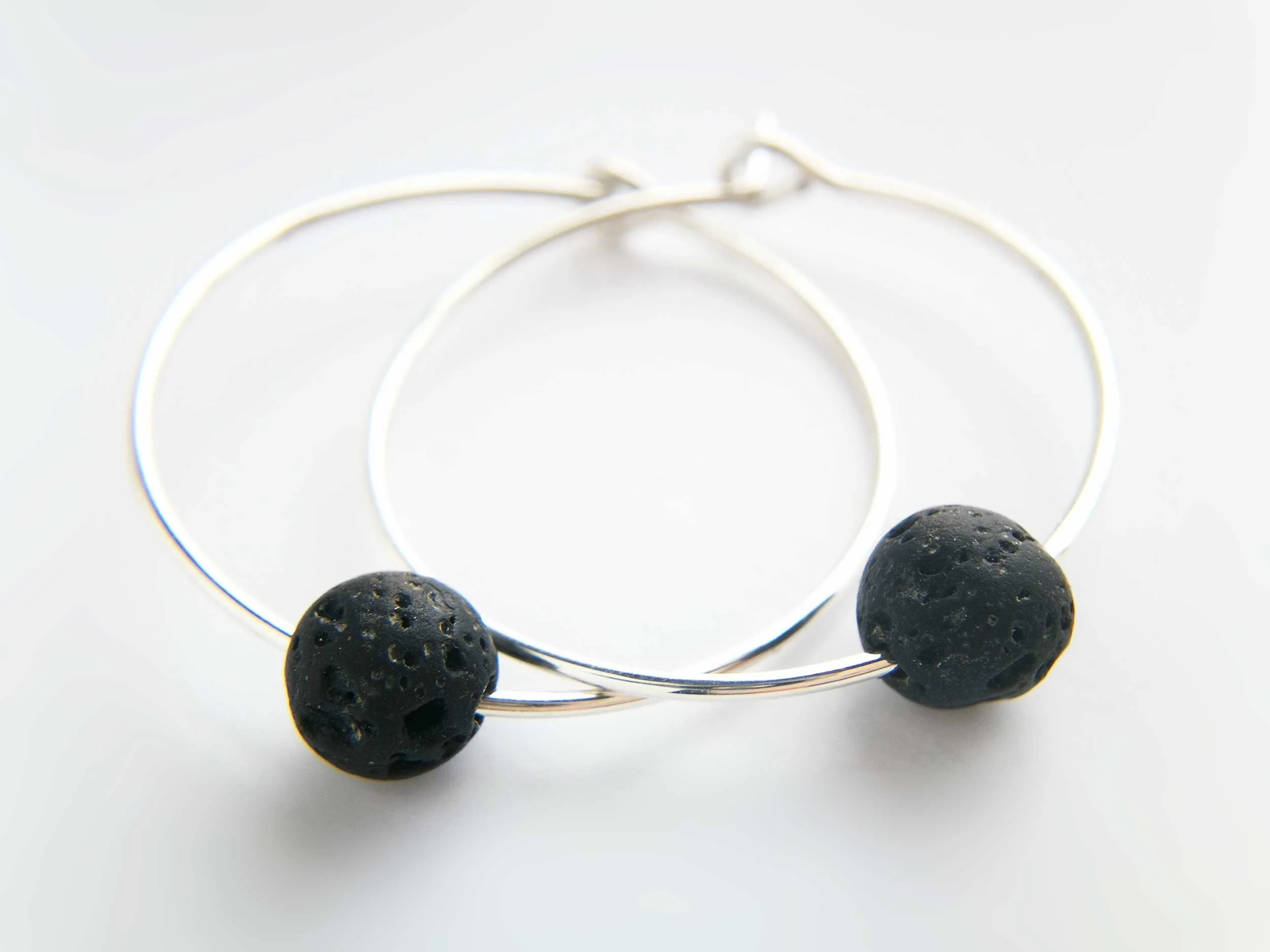 Recycled sterling silver and lava bead hoop earrings victoria grace silversmith white background