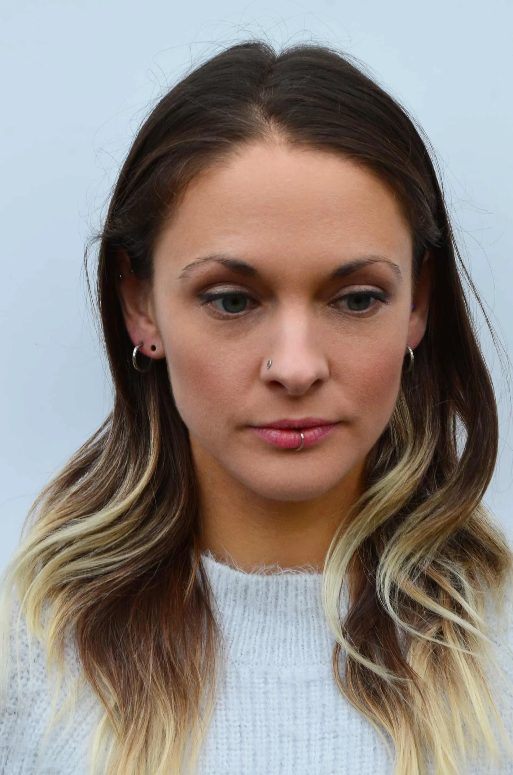 Statement hoop earrings on model winterland collection