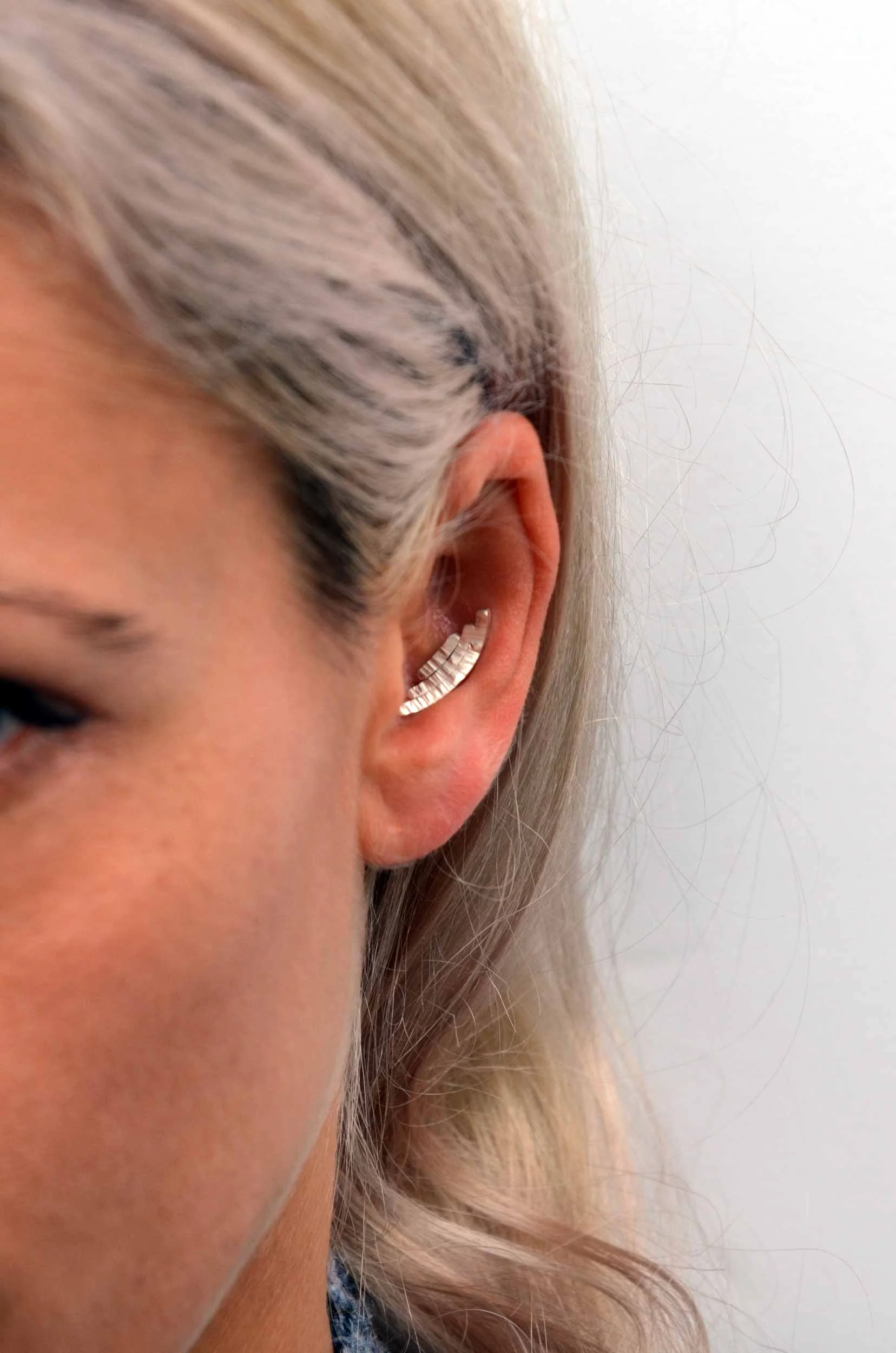 three bar silver conch earring on model victoria grace silversmith