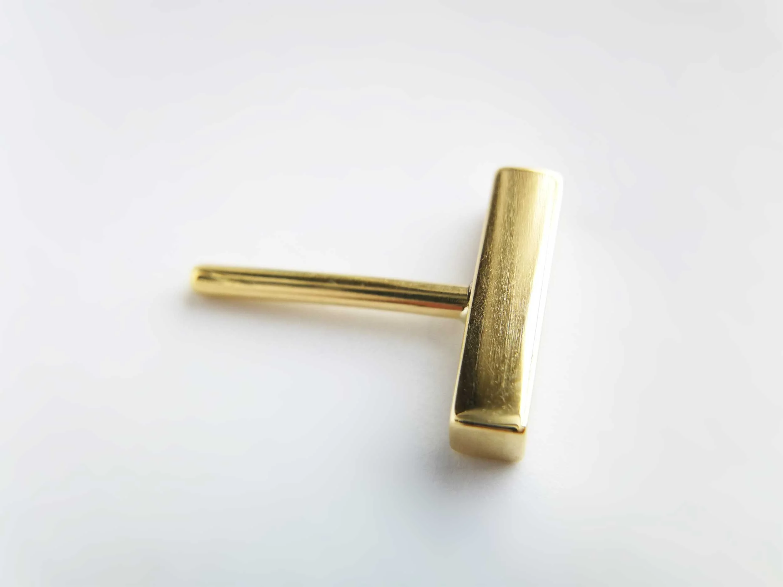 18k gold conch bar white background victoria grace silversmith