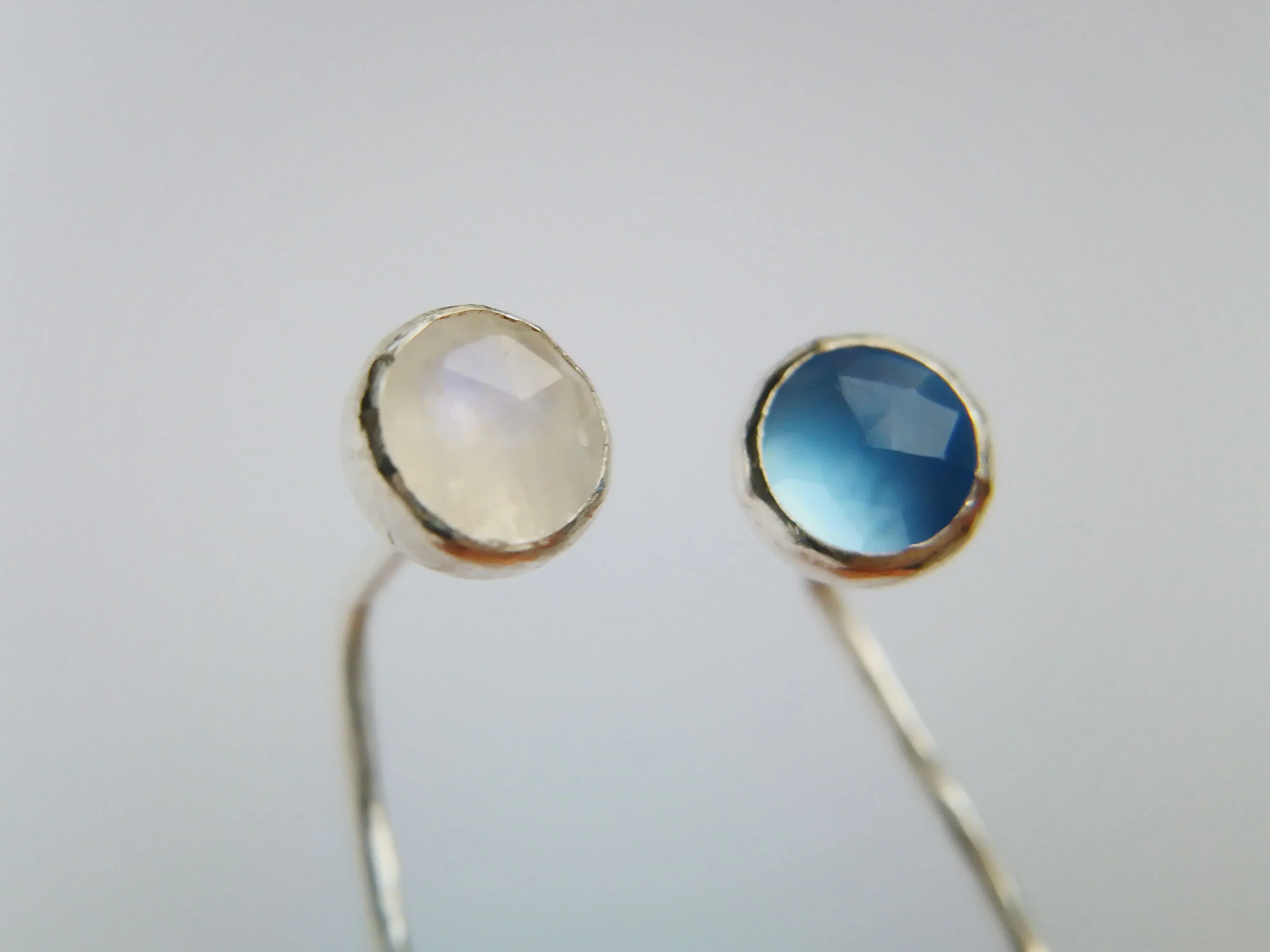 Handmade gemstone wire earrings close up on wire background