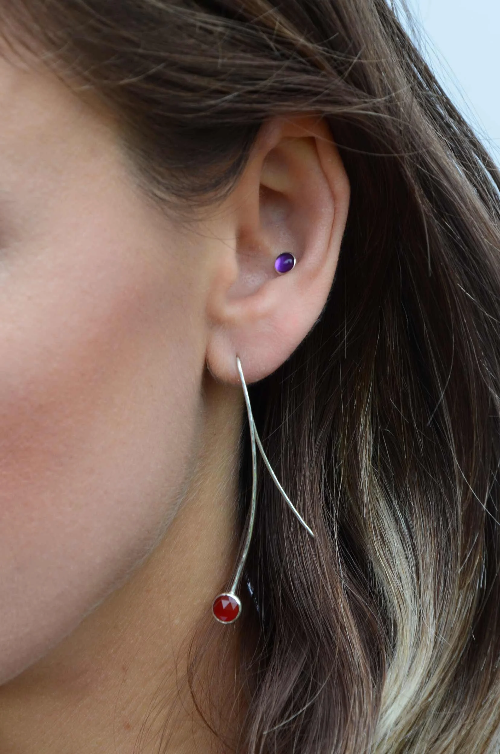 Carnelian gemstone wire drop earrings on model
