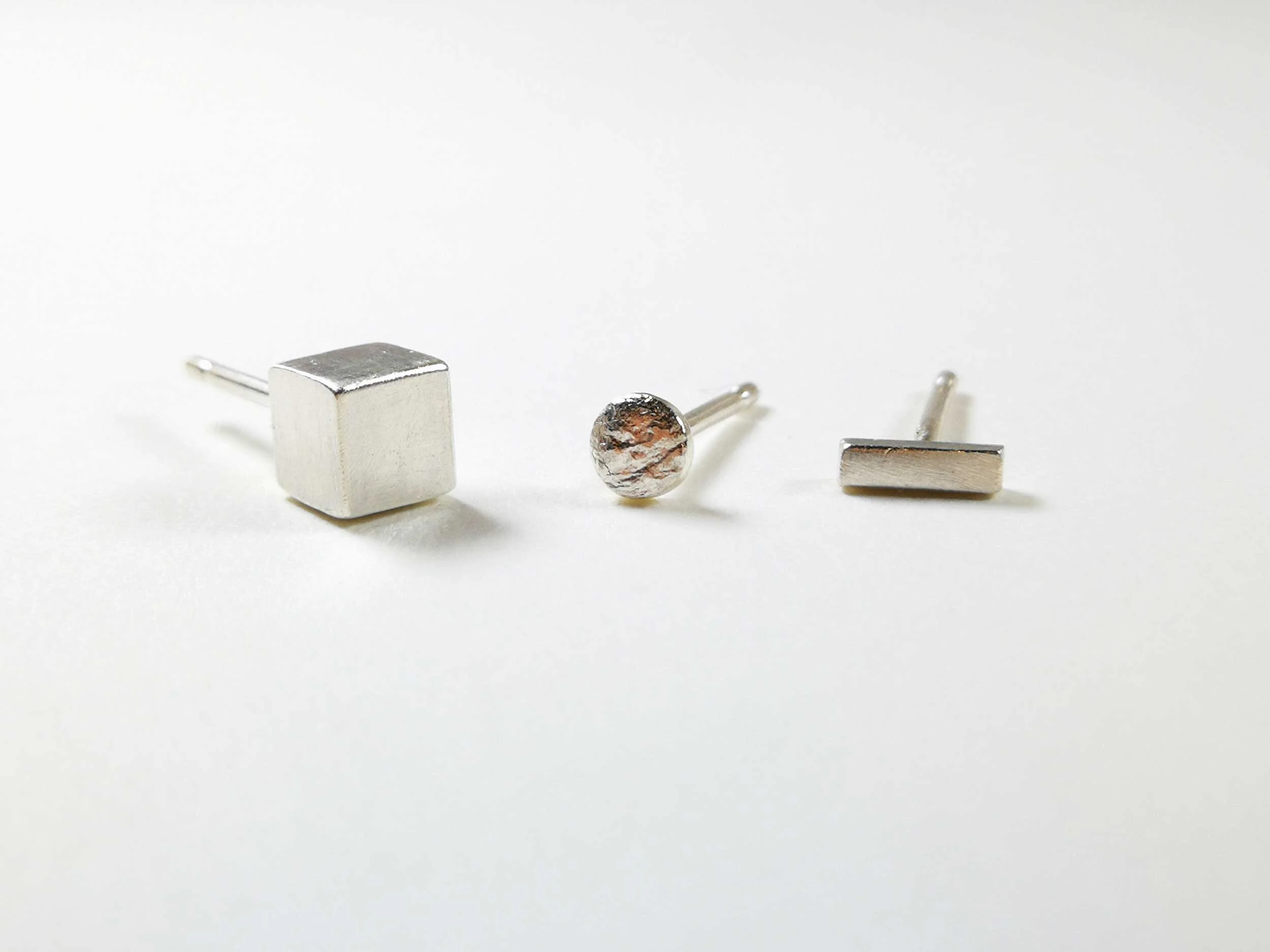 Silver mismatched earring set white background victoria grace silversmith