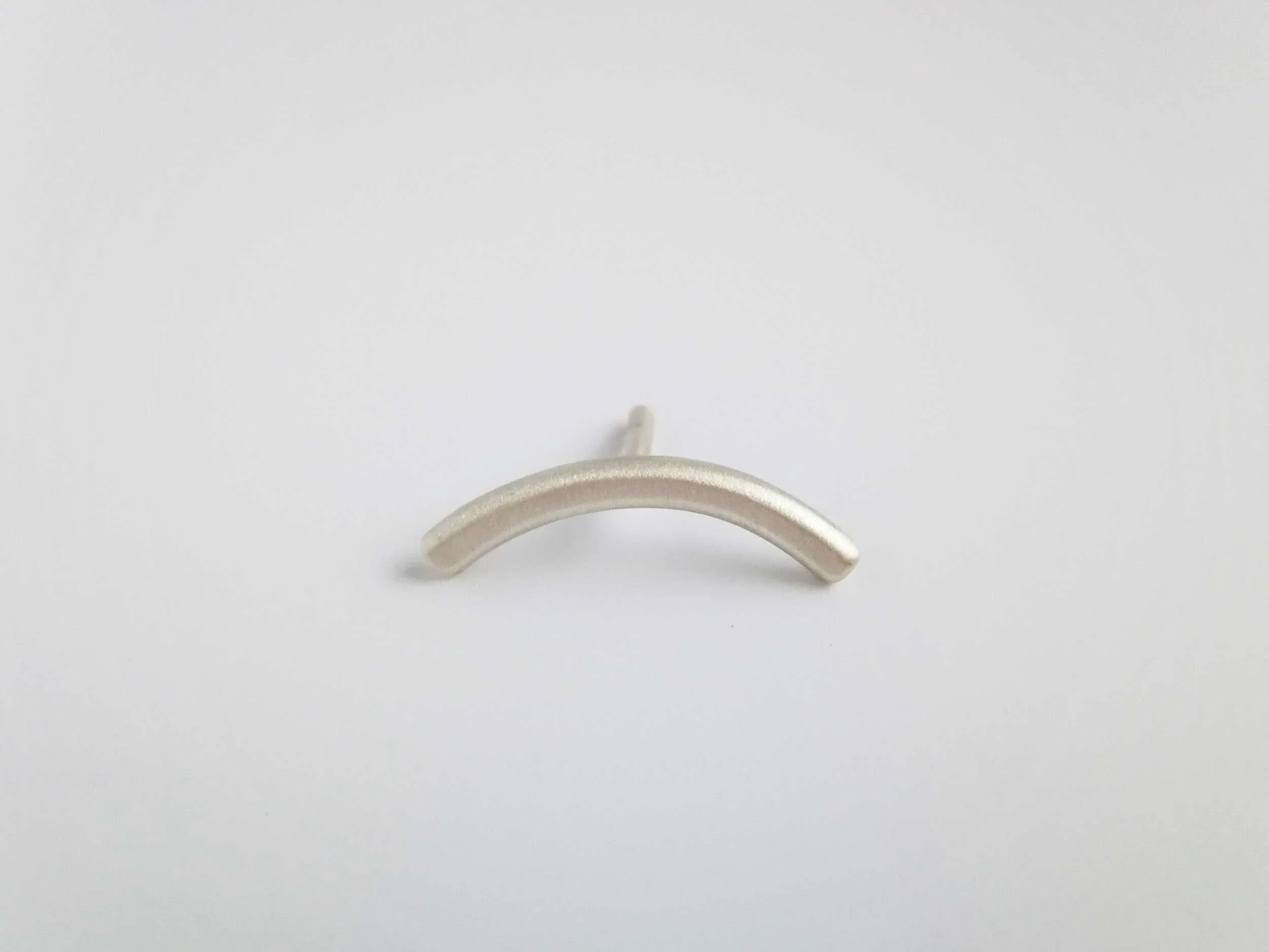 Silver satin finish helix earring handmade by victoria grace silversmith white background