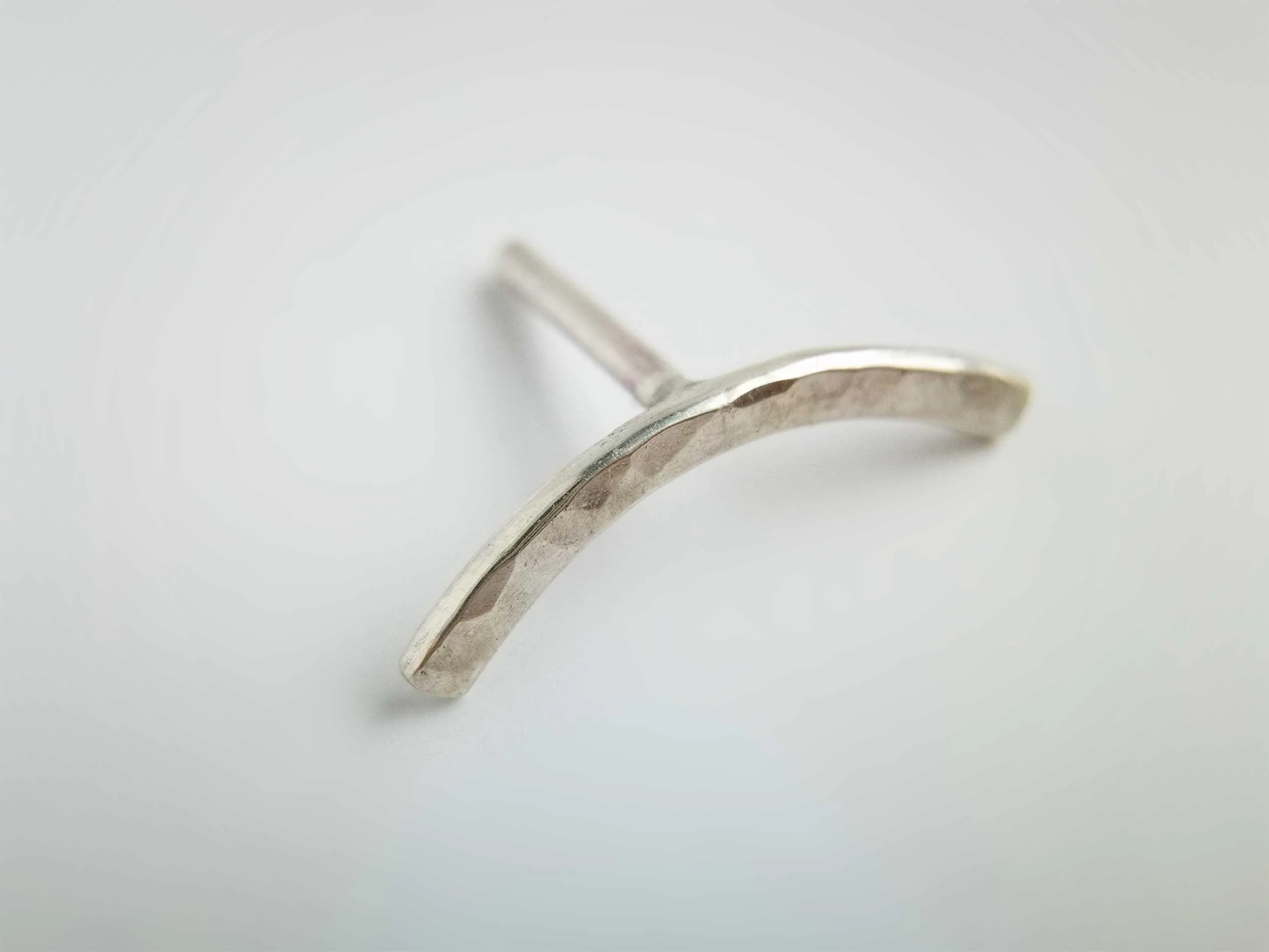 Recycled silver helix earring hammered finish on white background victoria grace silversmith