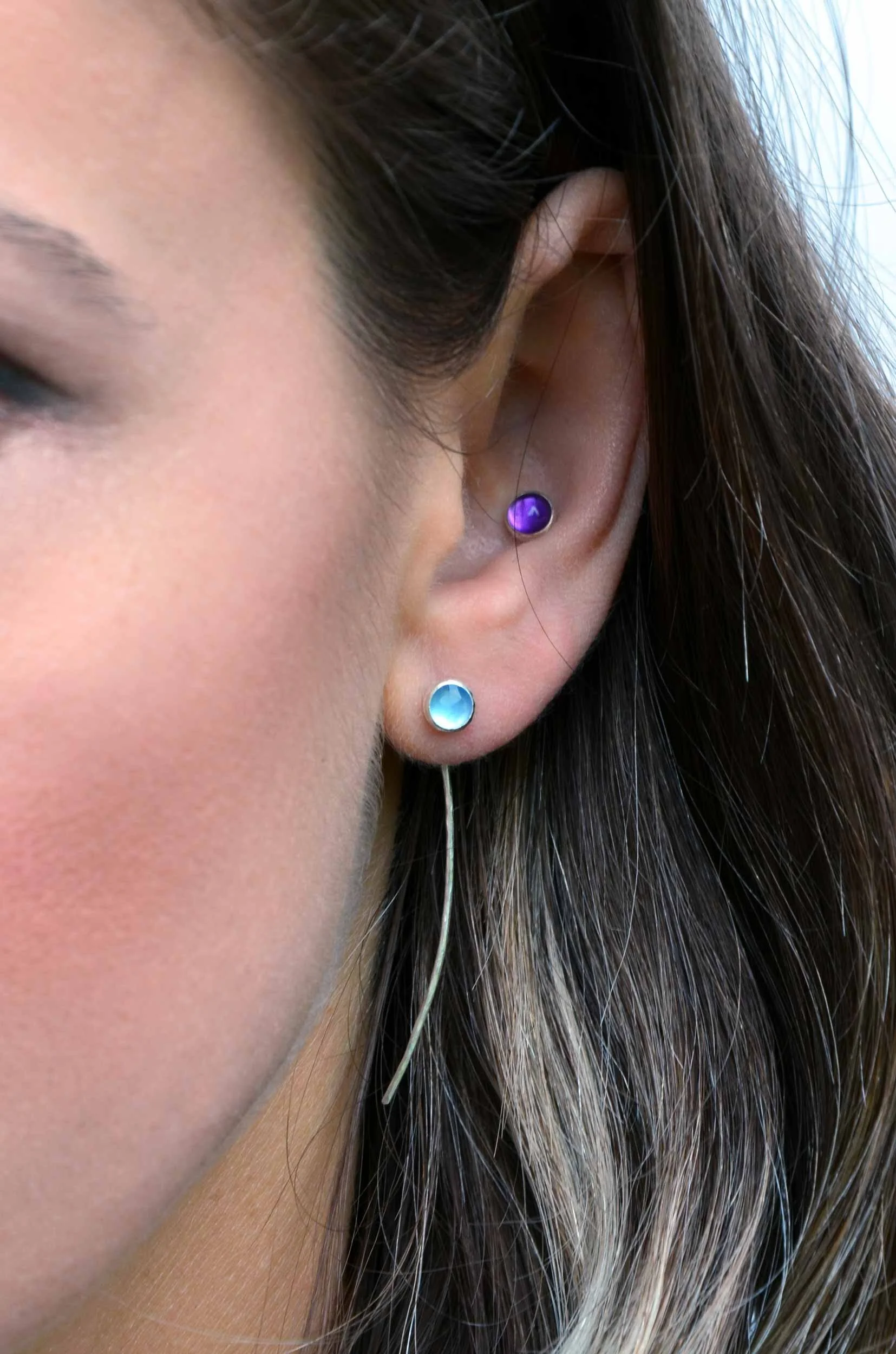 Blue chalcedony wire drop earrings handmade on model