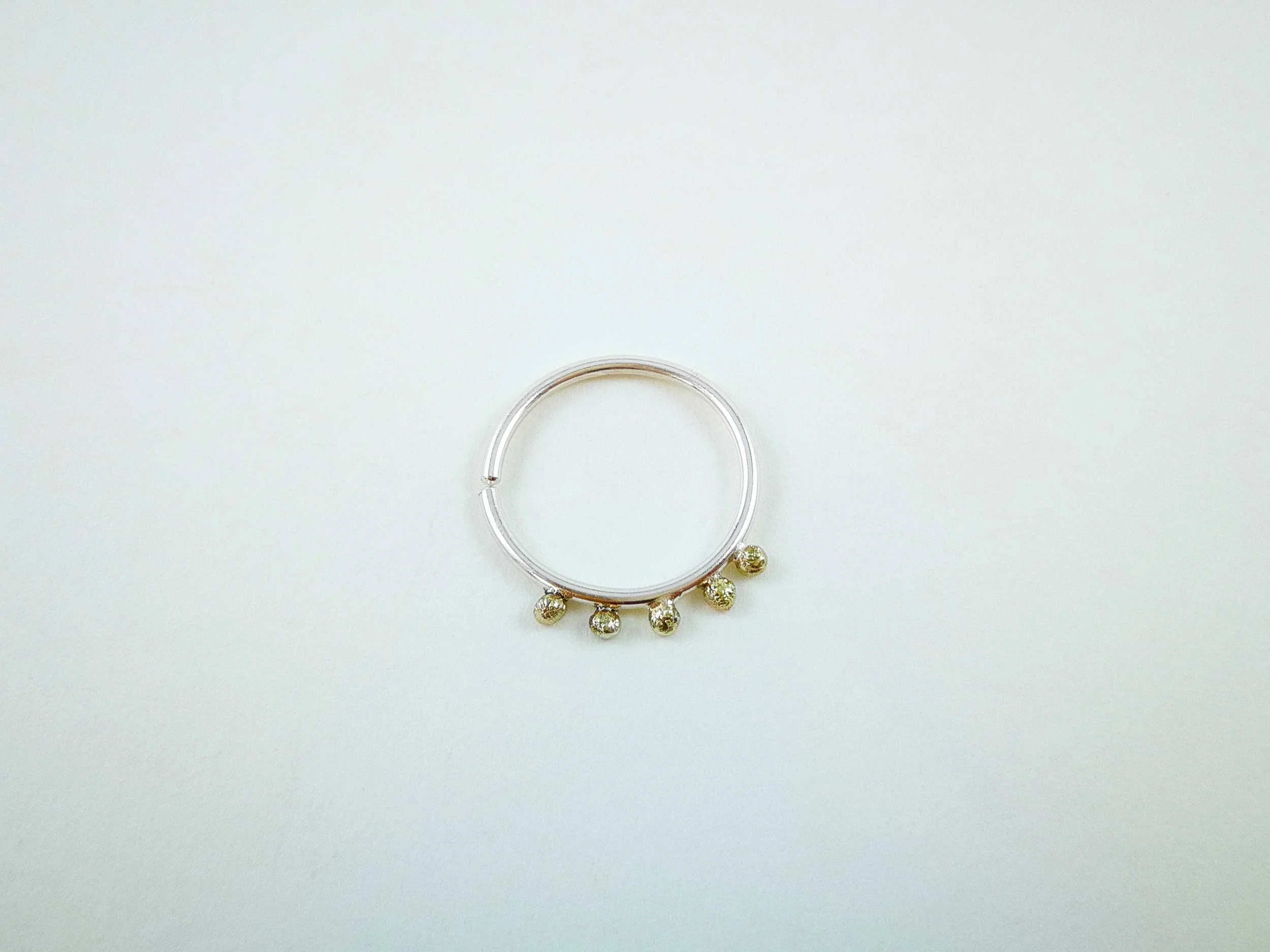 golden granulation conch hoop on white background