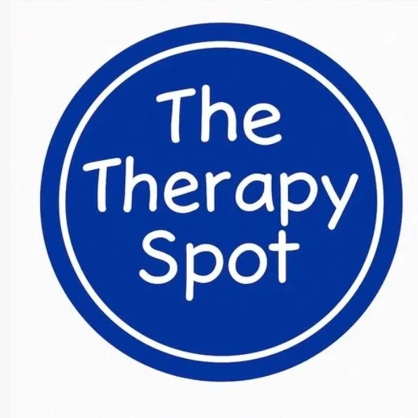 Blue circular logo with white text reading 'The Therapy Spot'