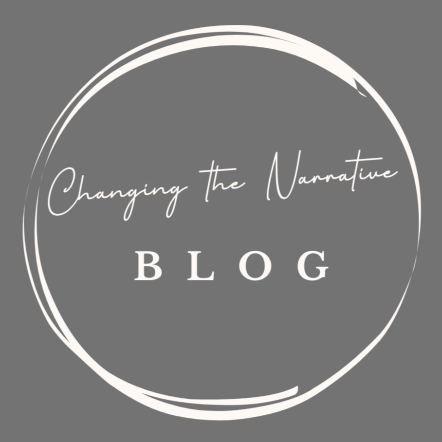A gray background with white text inside a circle that reads "Changing the Narrative BLOG."