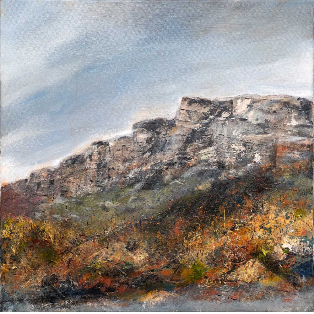 An impressionistic painting of a rugged mountain with a cloudy sky and colorful autumn foliage at its base.