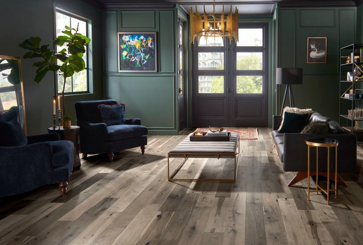 "Raise your hand if you want to spend your time here with your favorite winter movies and snacks. 👋

The dynamic blend of Oak, Hickory, and Maple that makes up @manningtonfloors handcrafted Hardwood pattern, Triumph, is the perfect backdrop to 