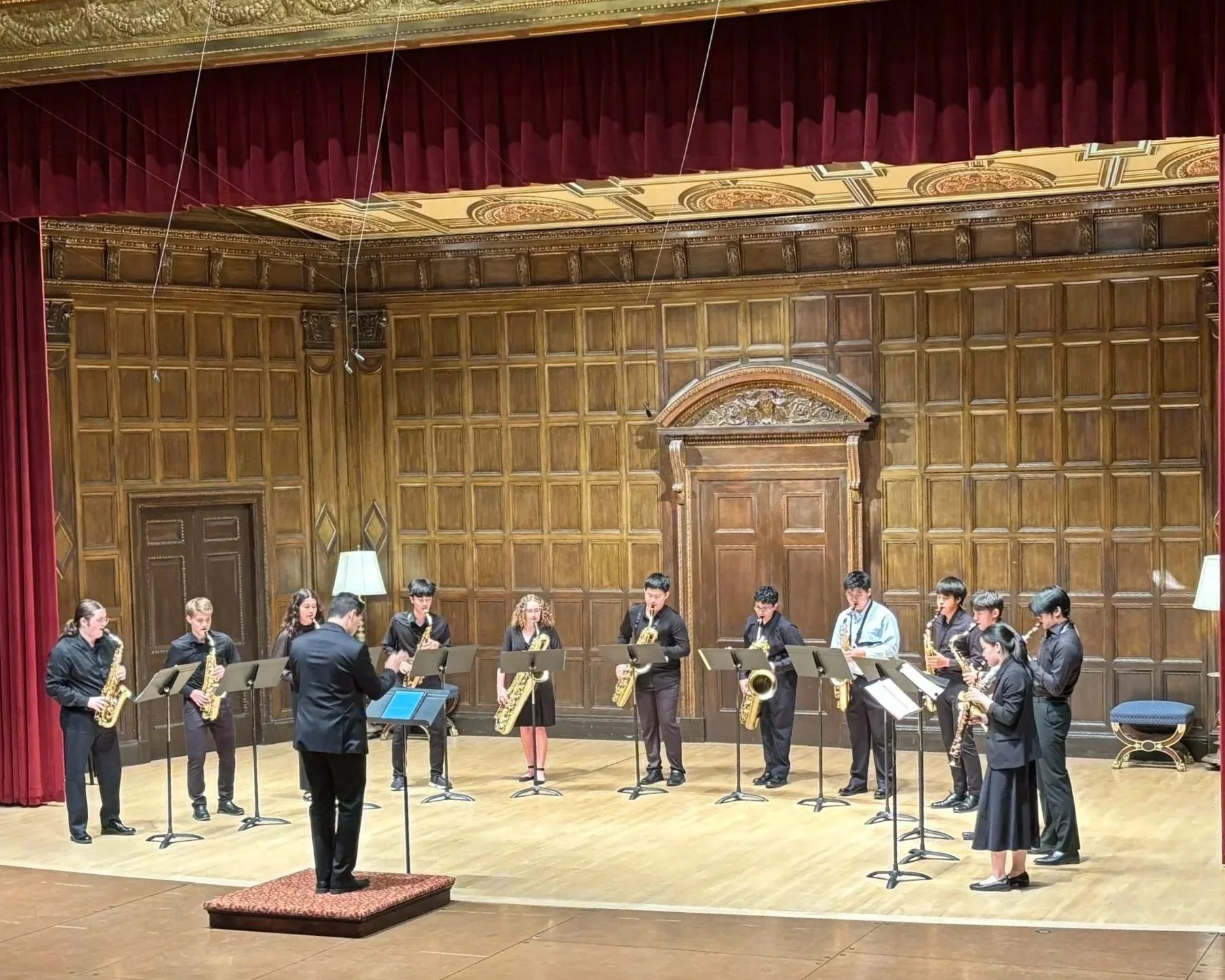 Landon Chang conducting the saxophone ensemble during the final gala concert of the Eastman Summer Saxophone Institute (ESSI) at the Eastman School of Music.