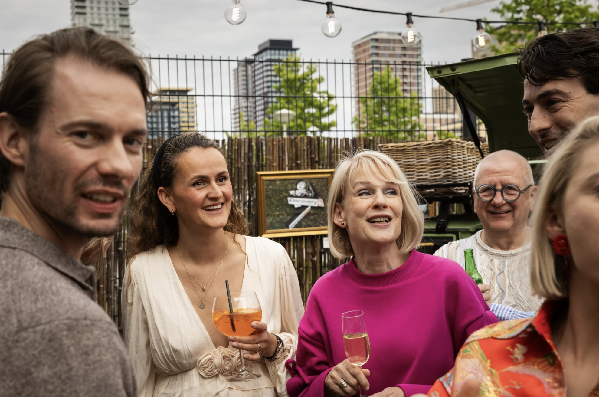 A group of people having a drink outside