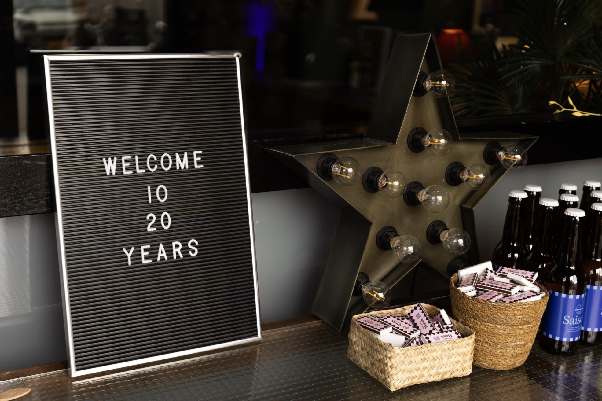 A welcome sign with WELCOME IO 20 YEARS
