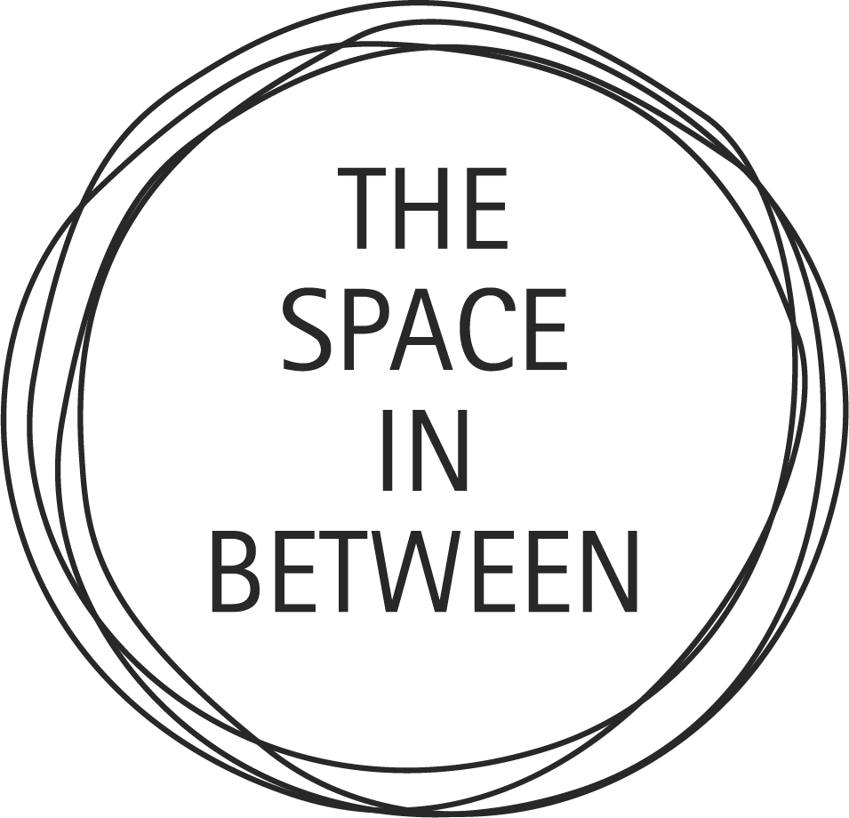 Black circular logo with the words 'THE SPACE IN BETWEEN' inside, surrounded by abstract concentric circles.