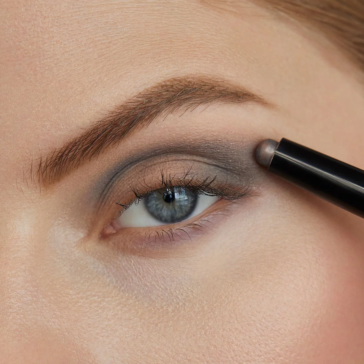 Close-up sequence showing eye shadow application