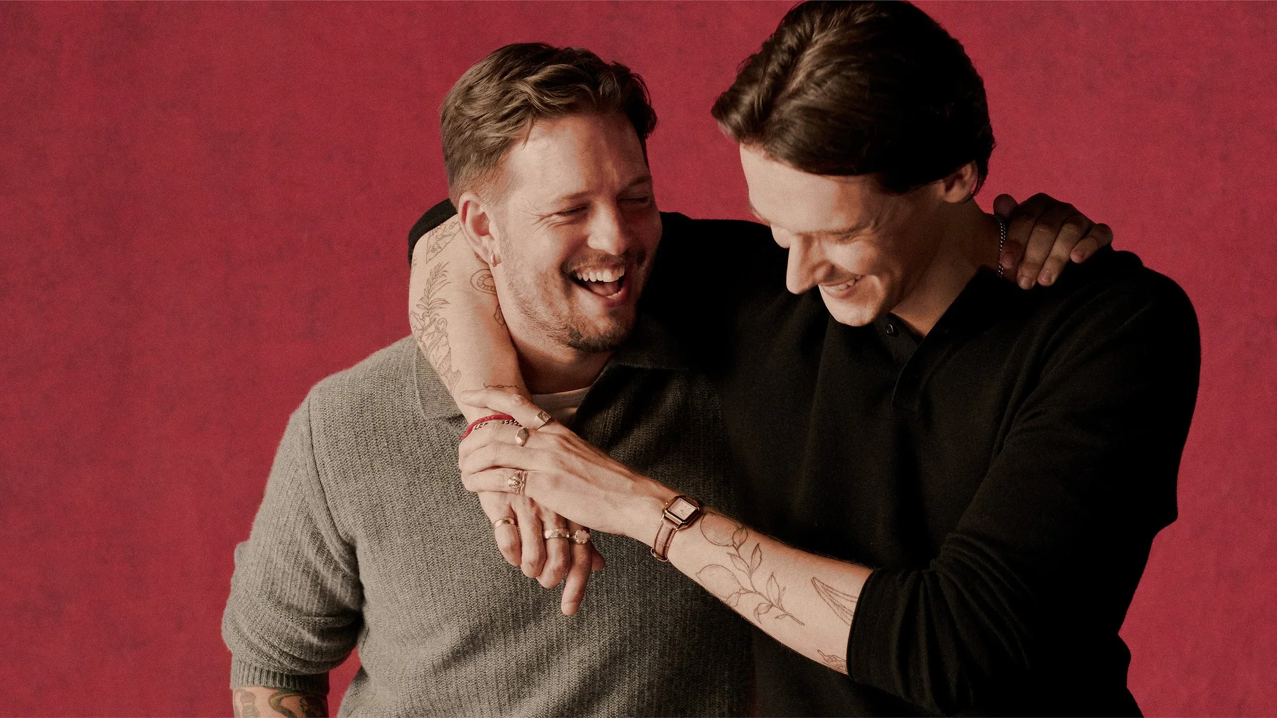 Two men laughing together in Molton Brown Christmas gifting campaign, reflecting natural, contemporary relationship storytelling.