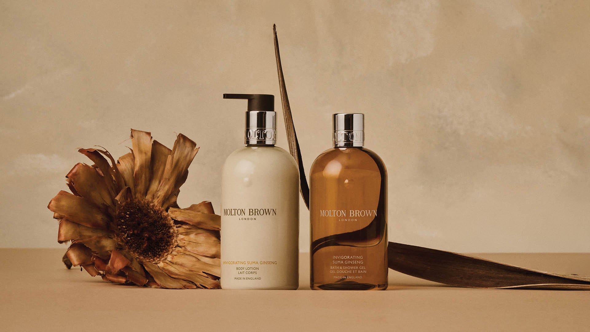 Molton Brown fragrance collection styled within a cohesive Evergreen colour system using a tonal backdrop.