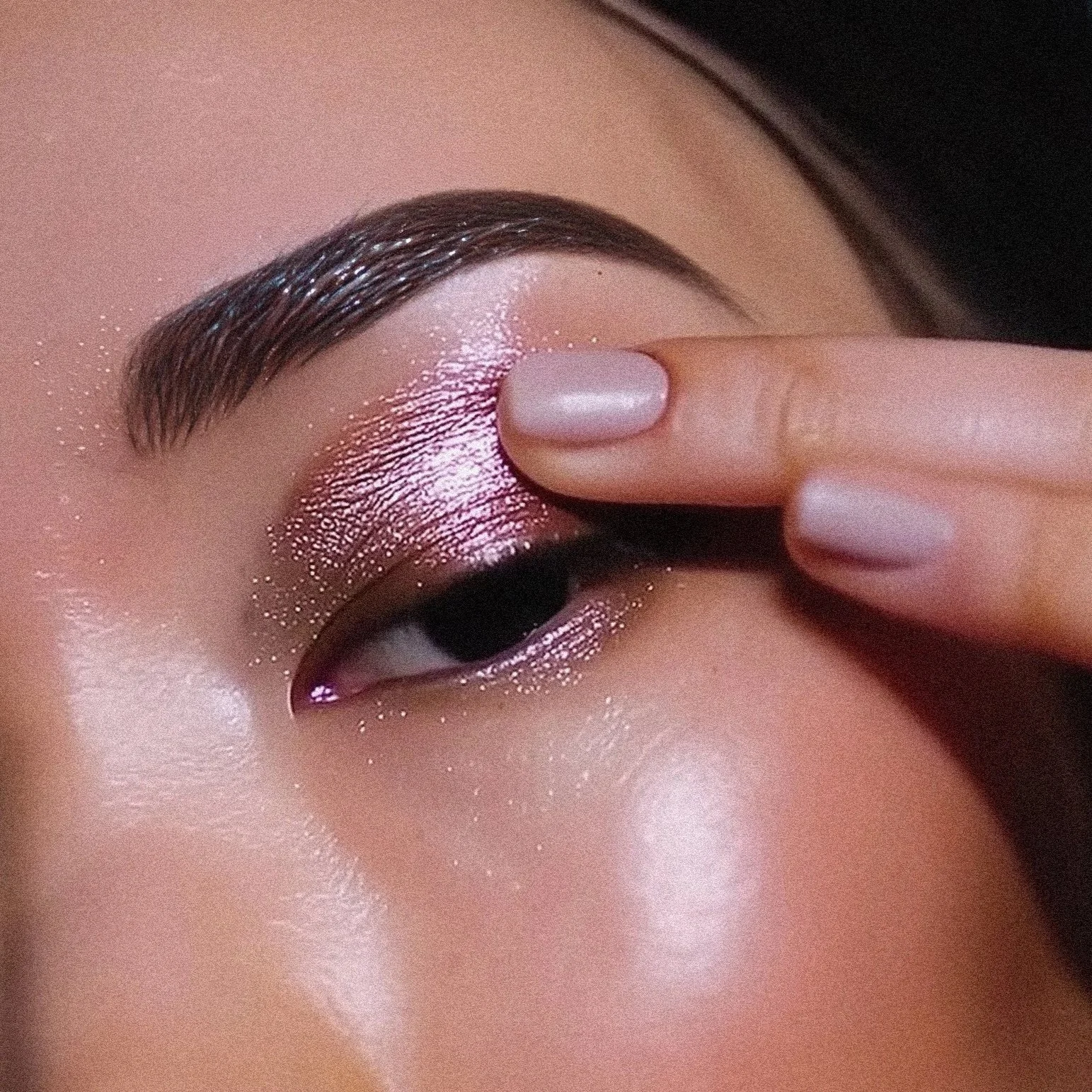 Metallic eyeshadow swatches across skin tones for beauty campaign