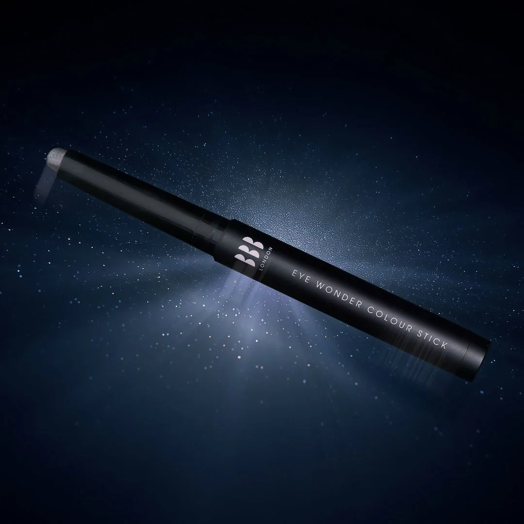 A black eyeliner pencil labeled 'BB London Eye Wonder Colour Stick' floating in space with a starry background.