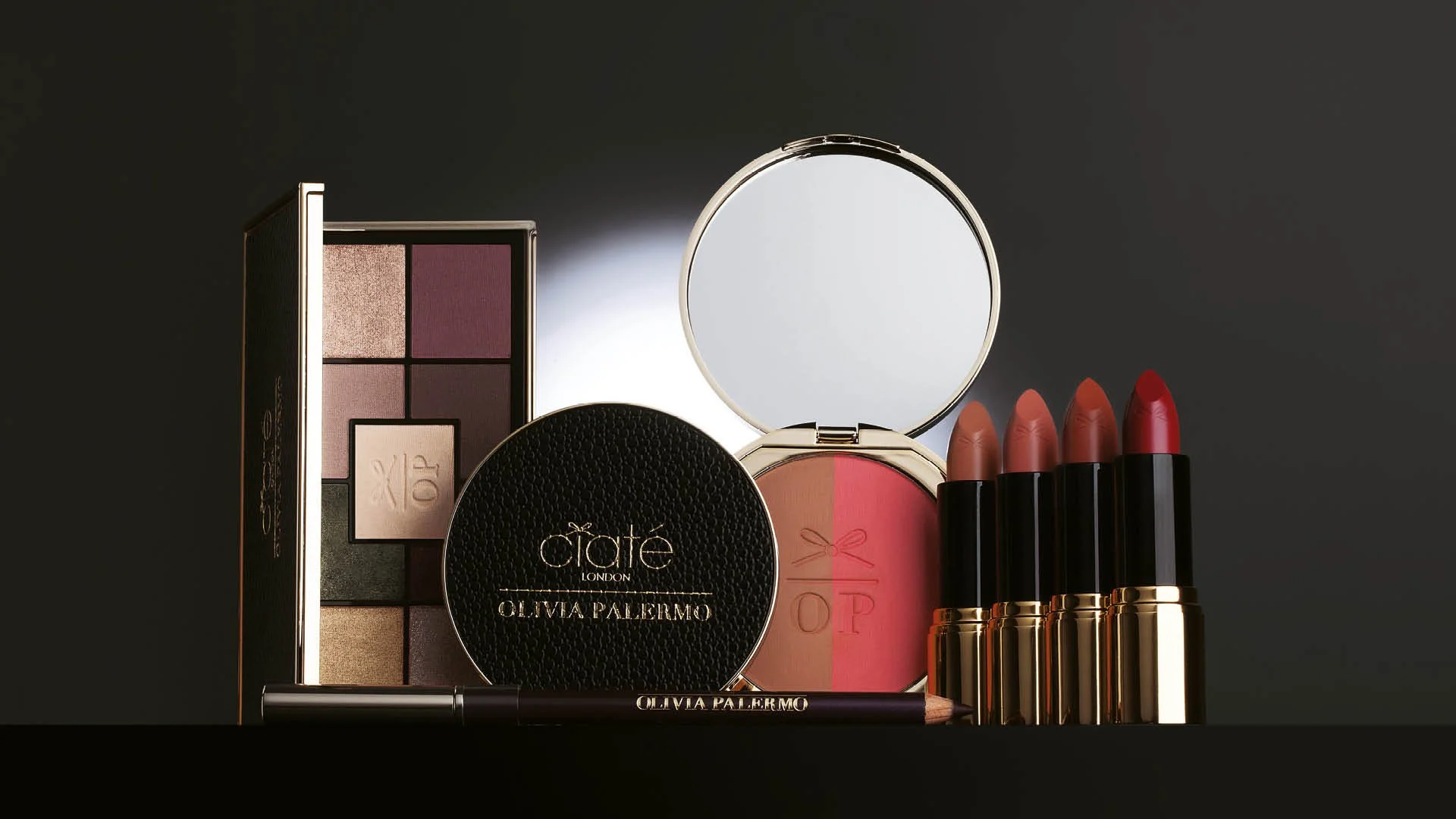 Hero product still life featuring eyeshadow palette, compact, blush and lipsticks from the Ciaté London x Olivia Palermo collection.