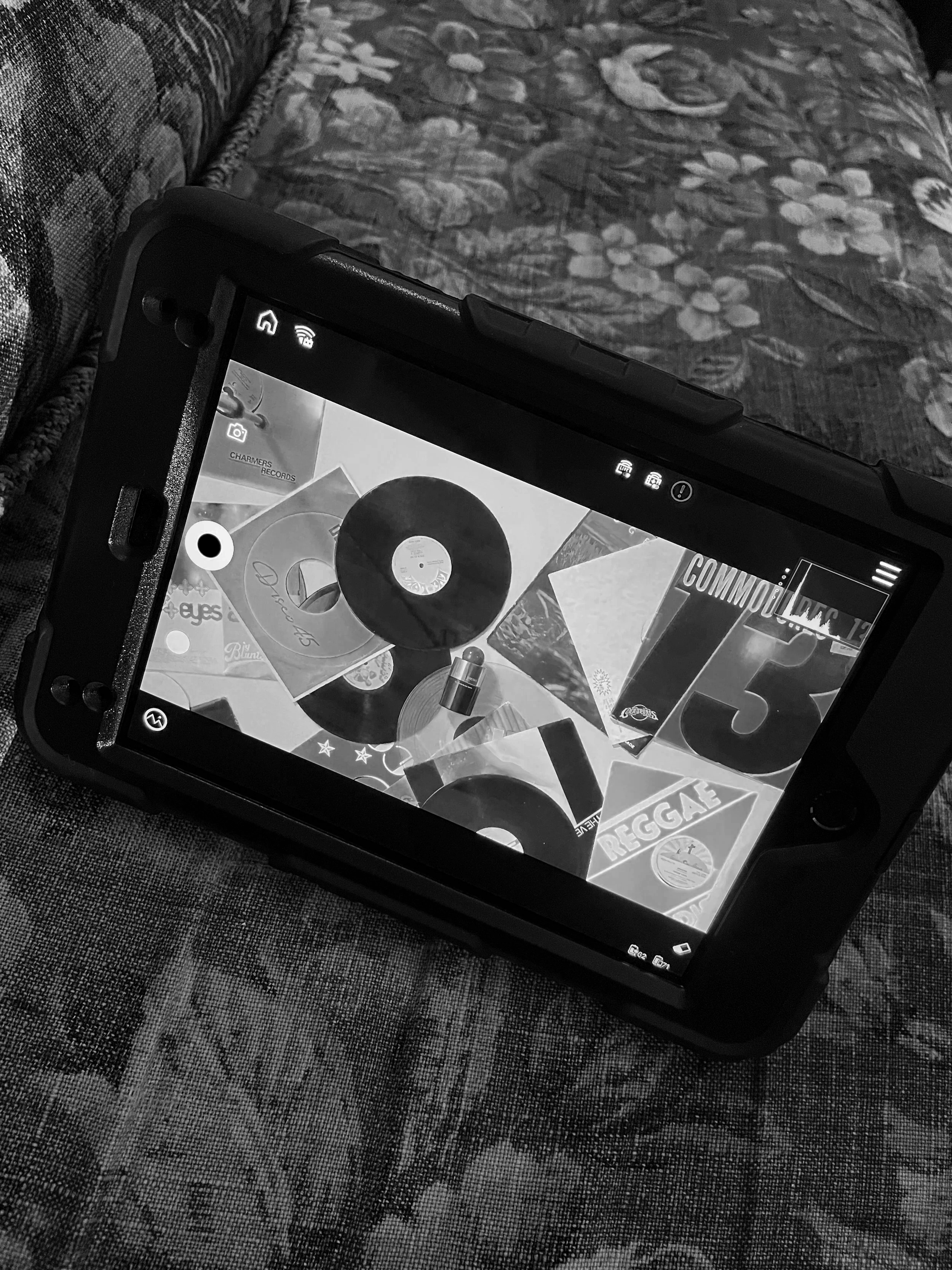 Camera monitor showing close-up fragrance shot during filming