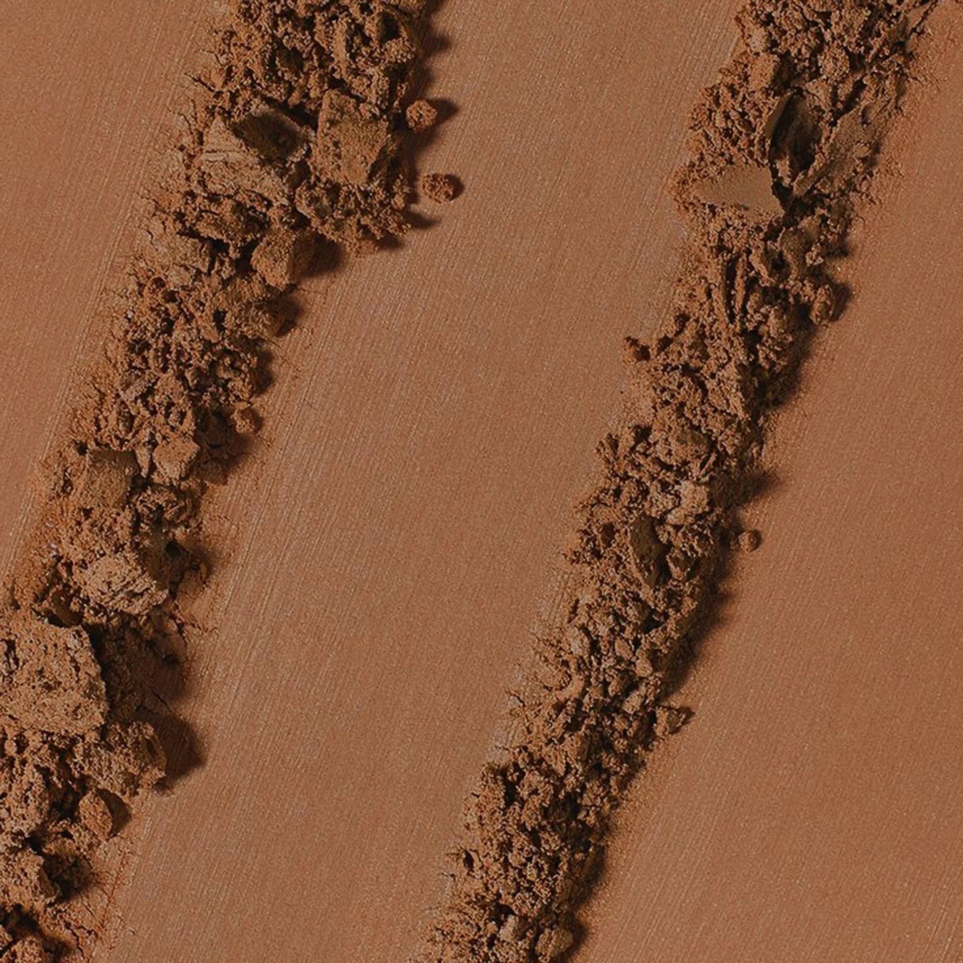 Highlighter and powder texture visuals for beauty campaign art direction